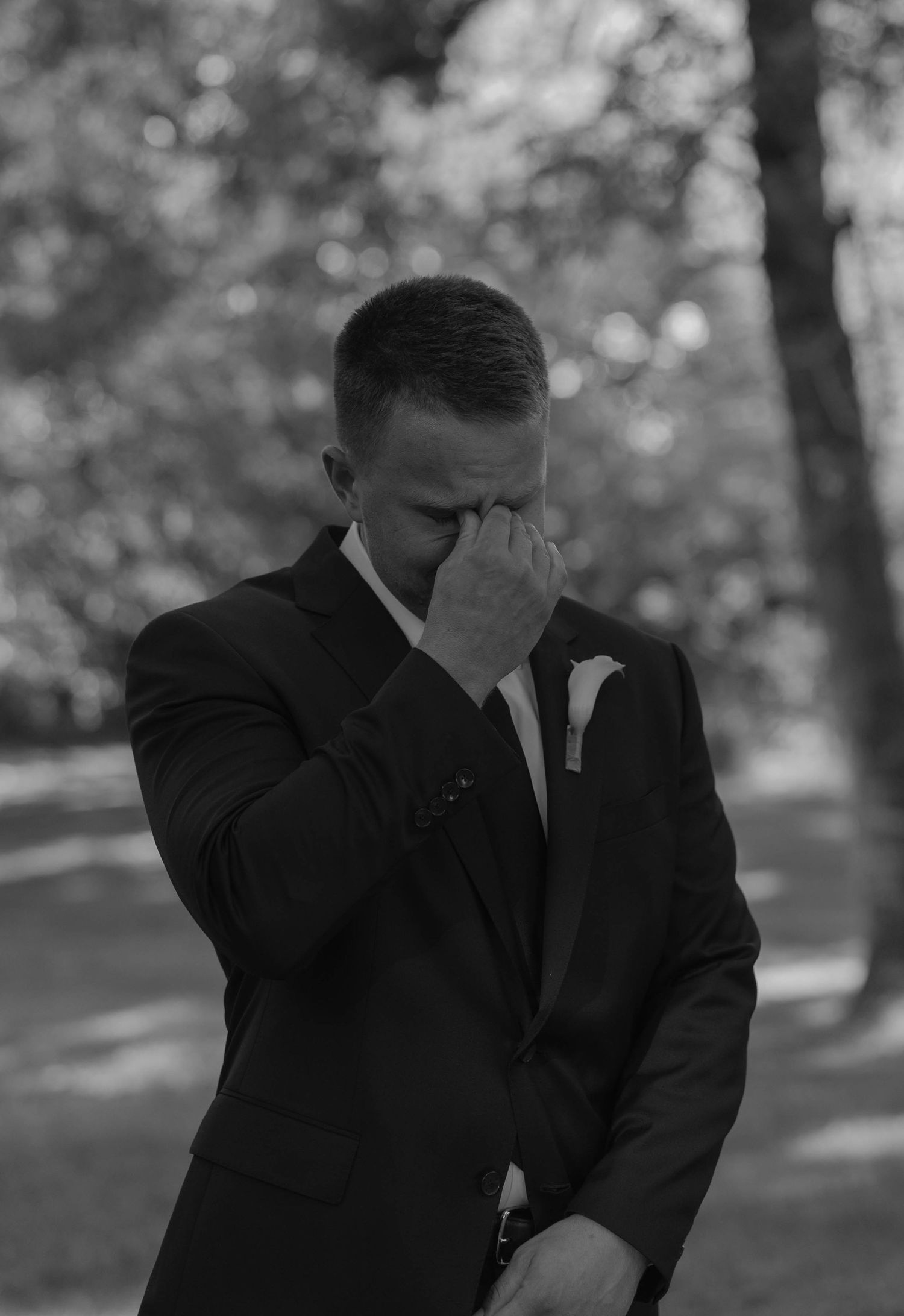 Birmingham Alabama Photographer capturing groom crying at ceremony space, at Iris Woods Venue in Nashville, Tennessee