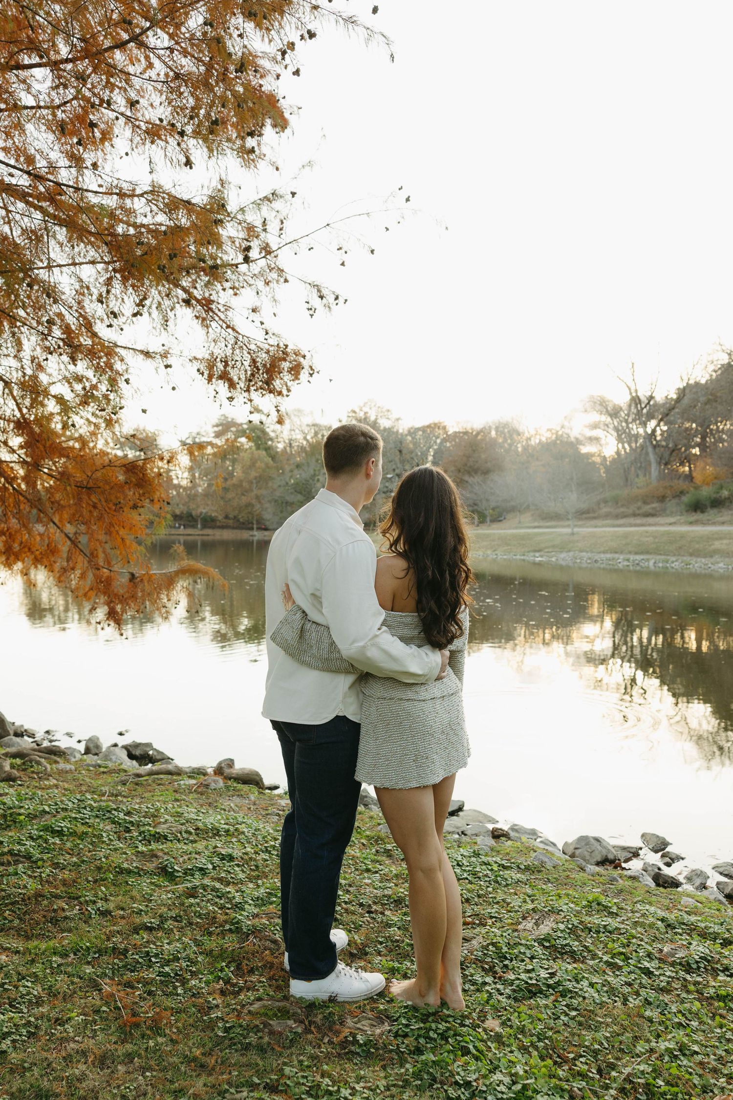 Birmingham Alabama Photographer capturing an engagement session of a couple hugging in a park in Nashville Tennessee