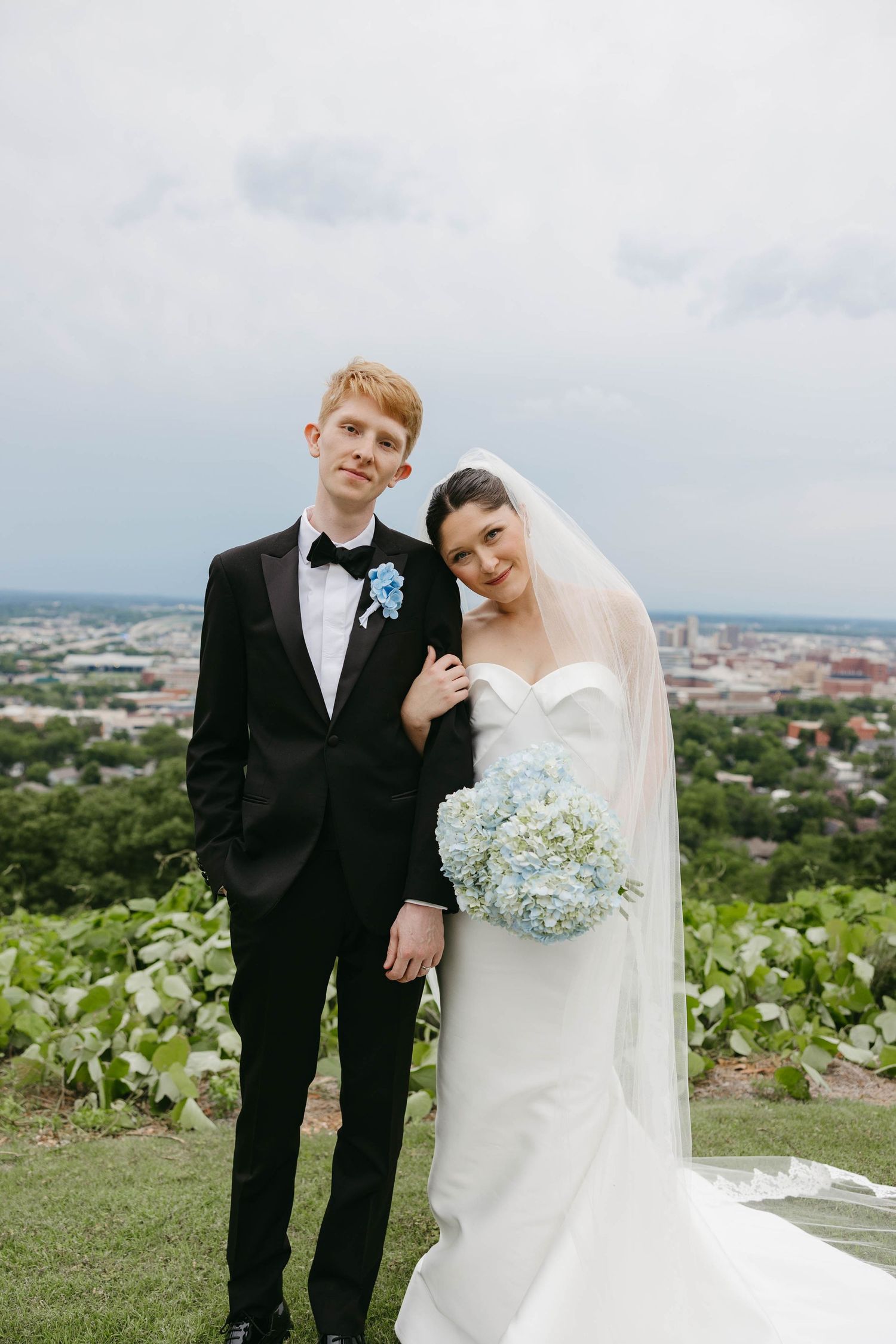 bride leaning on groom's shoulder