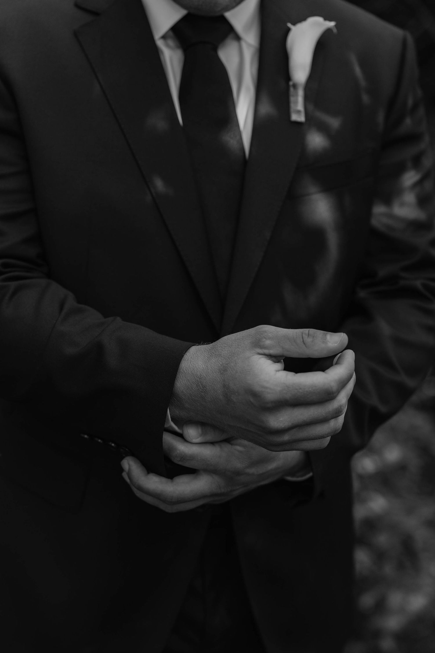 Birmingham Alabama Photographer capturing groom putting on his watch, at Iris Woods Venue in Nashville, Tennessee