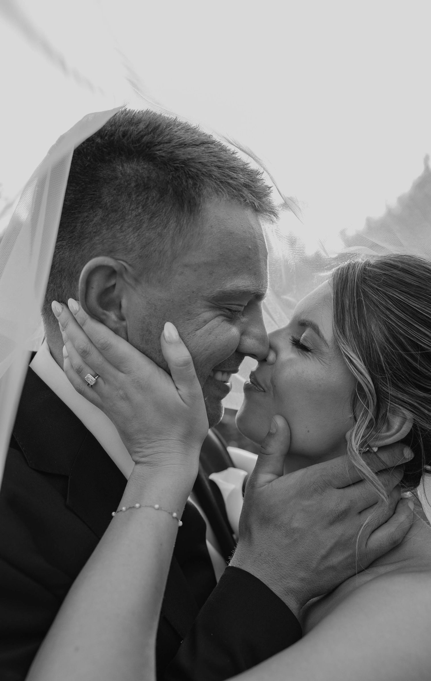 Birmingham Alabama Photographer capturing bride and groom kissing in a field, at Iris Woods Venue in Nashville, Tennessee