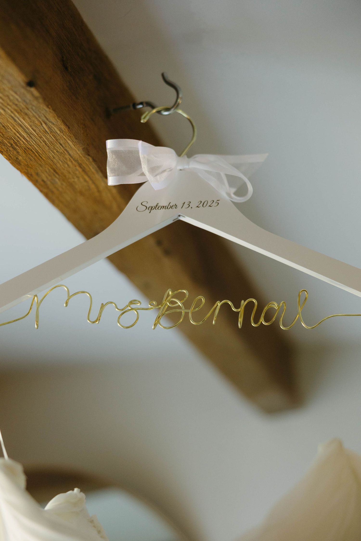 Birmingham Alabama Photographer capturing bride's special wedding dress hanger at Iris Woods Venue in Nashville, Tennessee