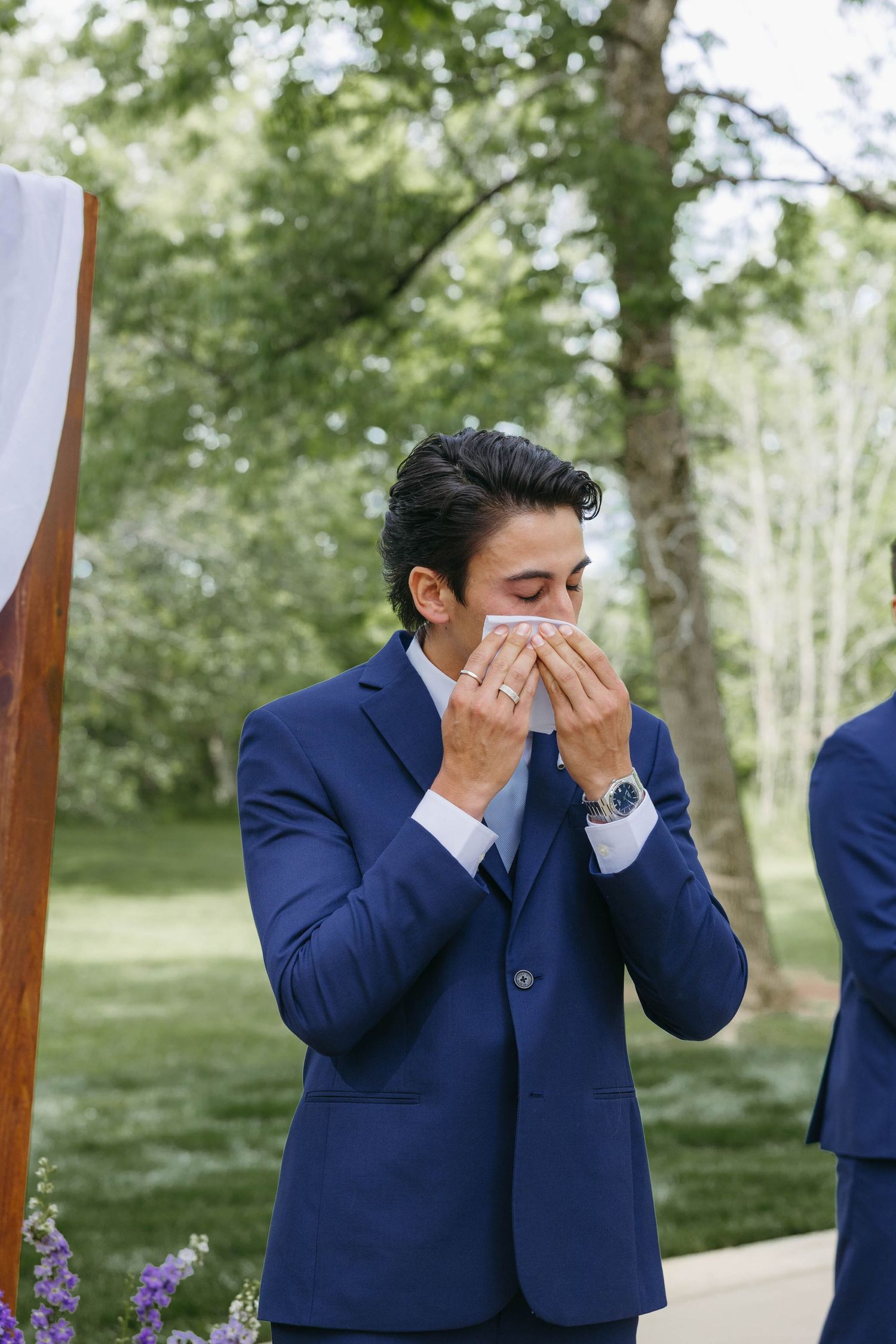 Birmingham Alabama Photographer capturing groom crying at the ceremony space, at Iris Woods Venue in Nashville, Tennessee