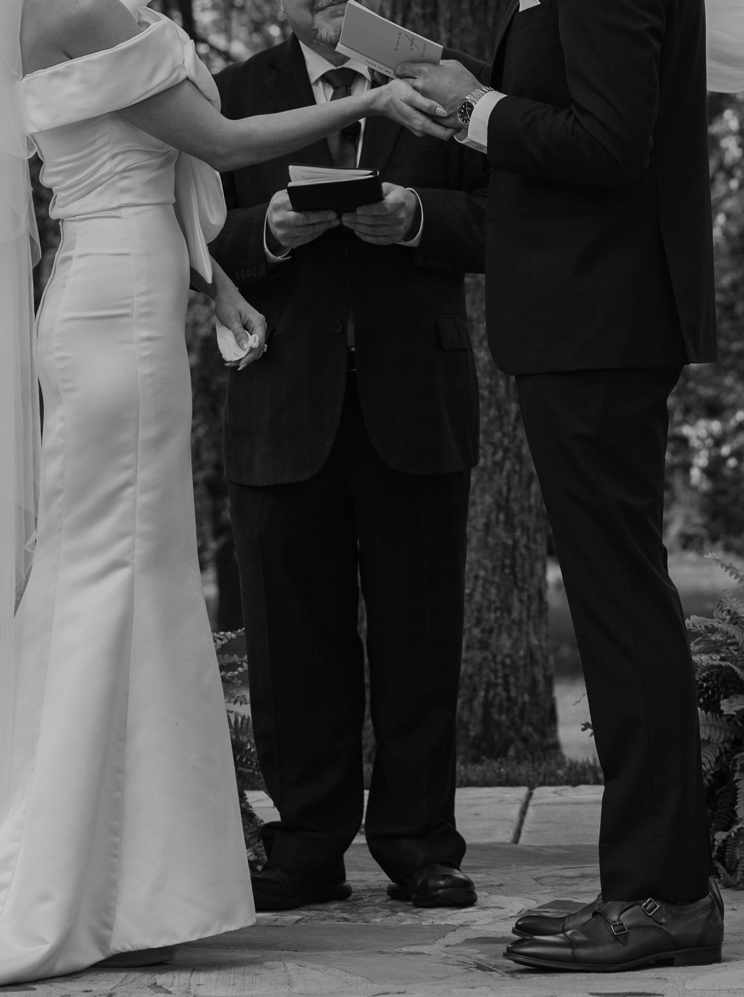 Birmingham Alabama Photographer capturing bride and groom holding hands at the ceremony space, at Iris Woods Venue in Nashville, Tennessee