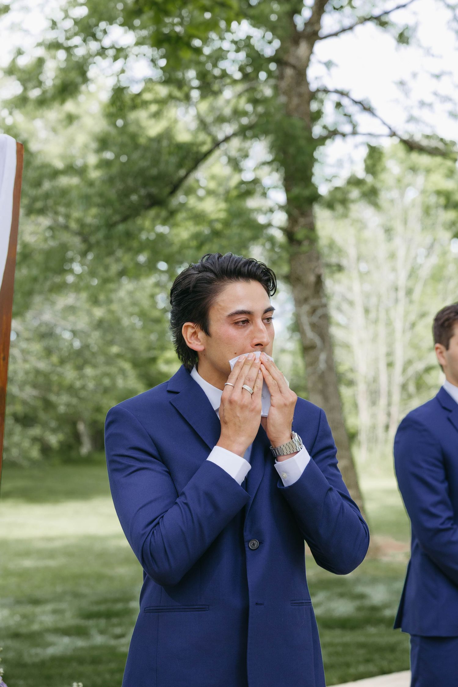 Birmingham Alabama Photographer capturing groom crying at the ceremony space, at Iris Woods Venue in Nashville, Tennessee