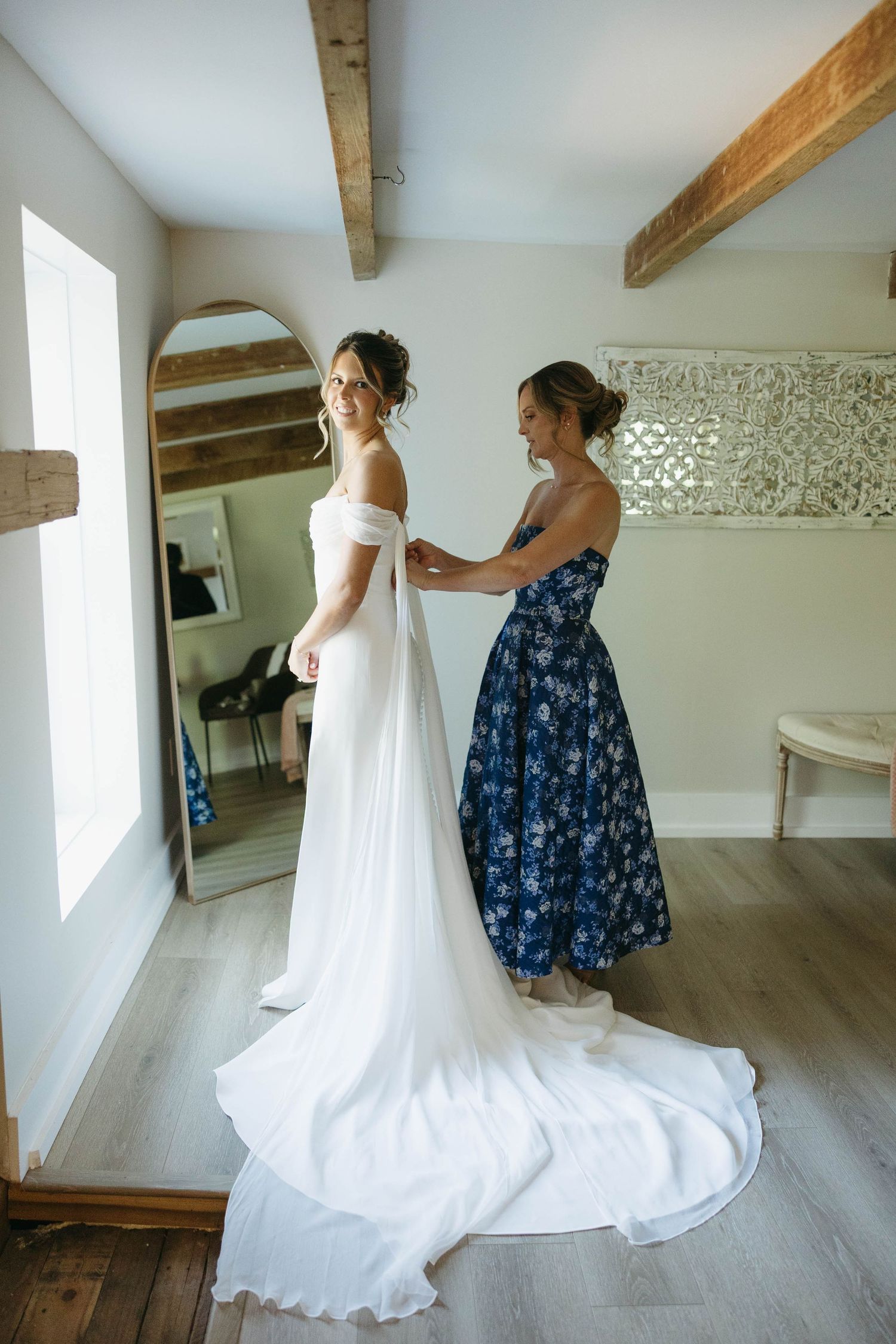 Birmingham Alabama Photographer capturing mother of bride putting on the bride's dress, at Iris Woods Venue in Nashville, Tennessee