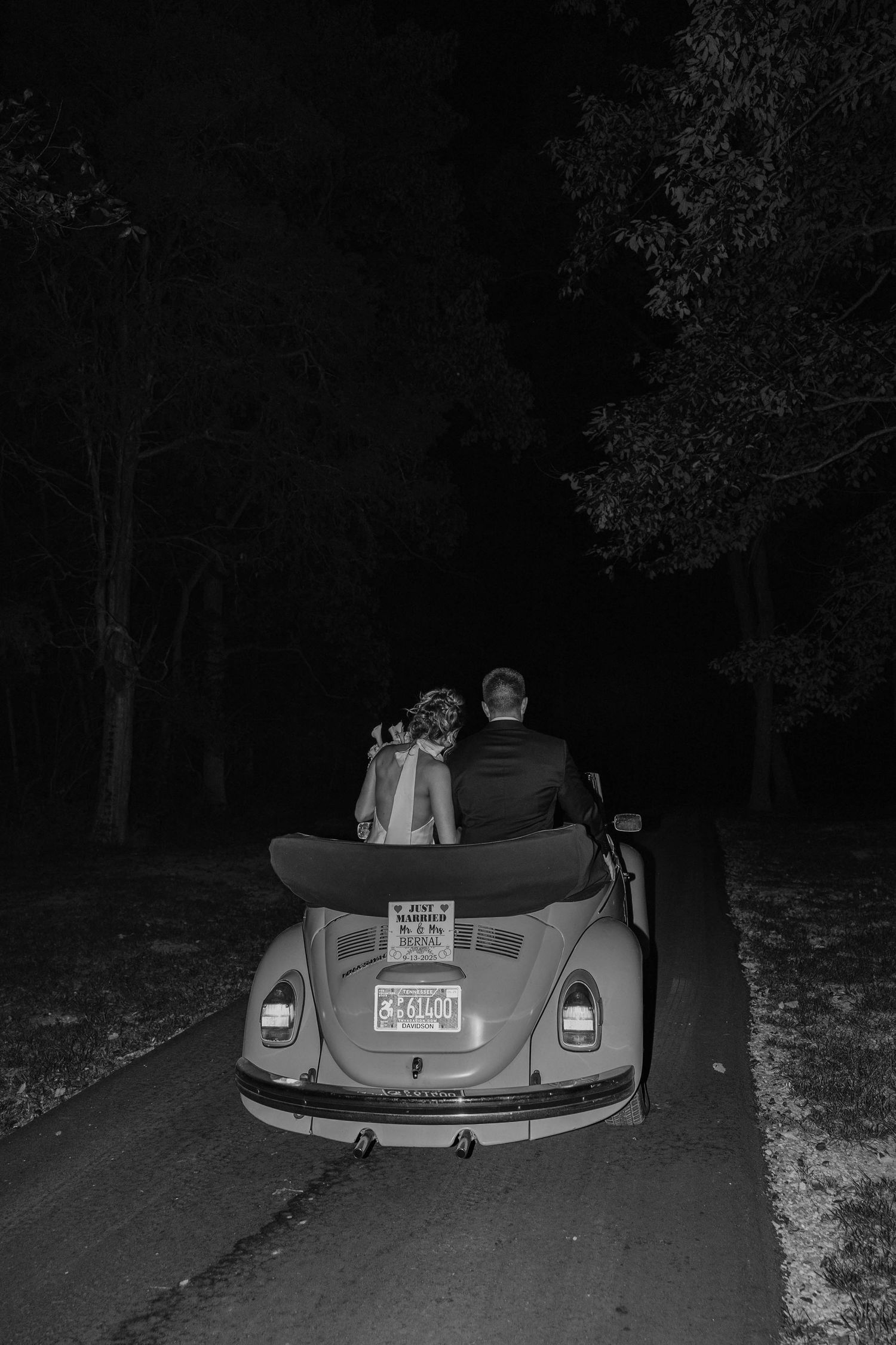 Birmingham Alabama Photographer capturing a couple driving off in a Volkswagen Beetle, at Iris Woods Venue in Nashville, Tennessee