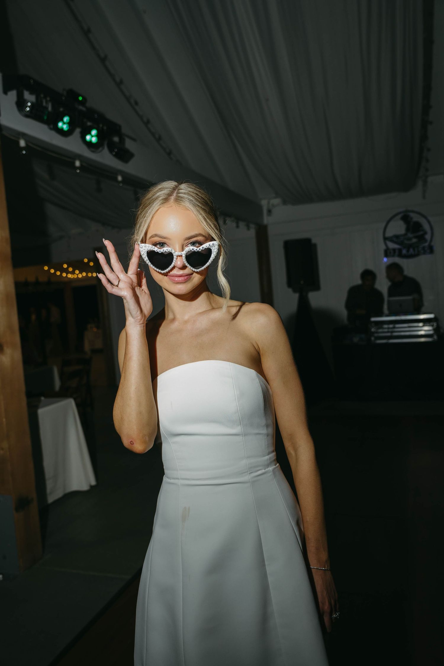 Birmingham Alabama Photographer capturing Bride posing with heart glasses at reception, at iris woods wedding venue in Nashville Tennessee