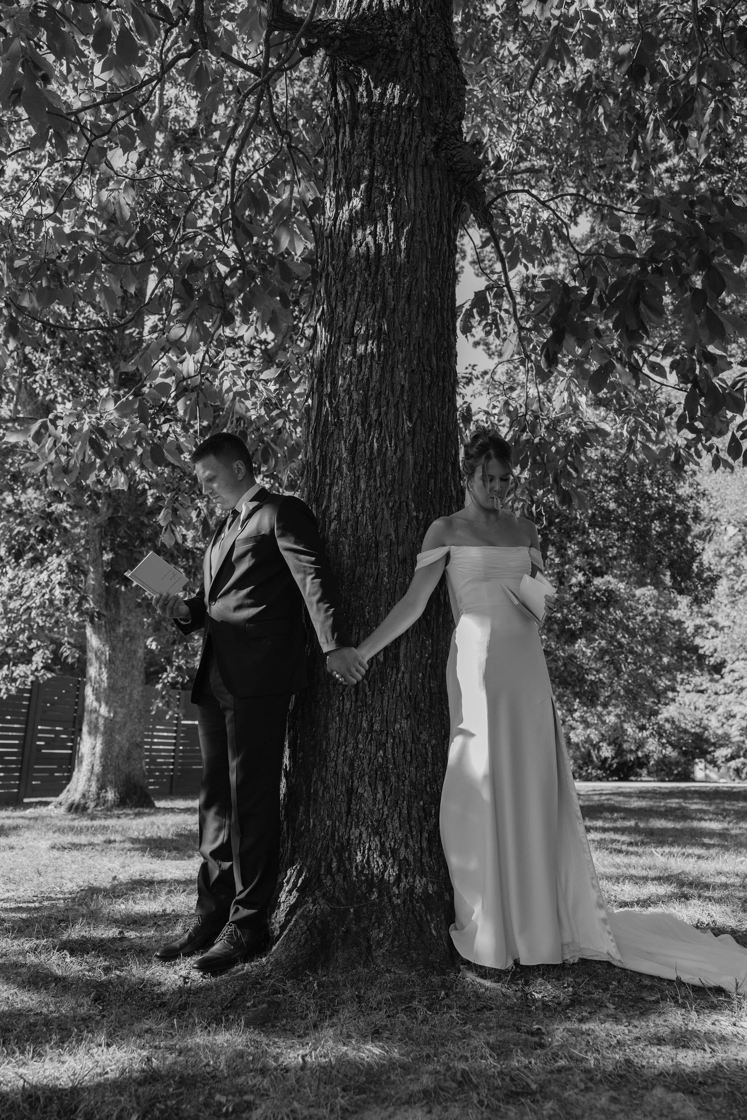 Birmingham Alabama Photographer capturing bride and groom reading their pre wedding vows, at Iris Woods Venue in Nashville, Tennessee