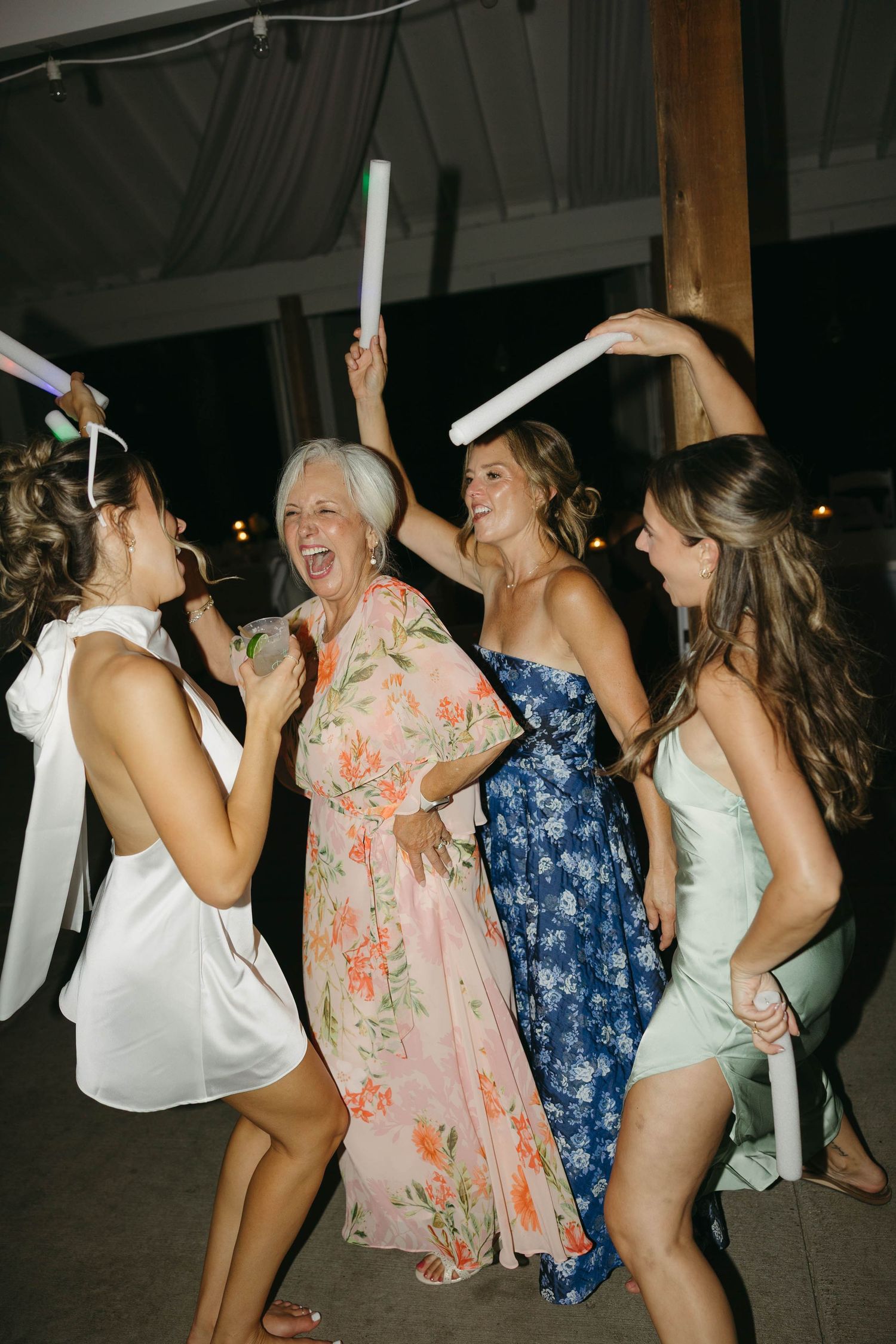 Birmingham Alabama Photographer capturing guests dancing during the reception, at Iris Woods Venue in Nashville, Tennessee