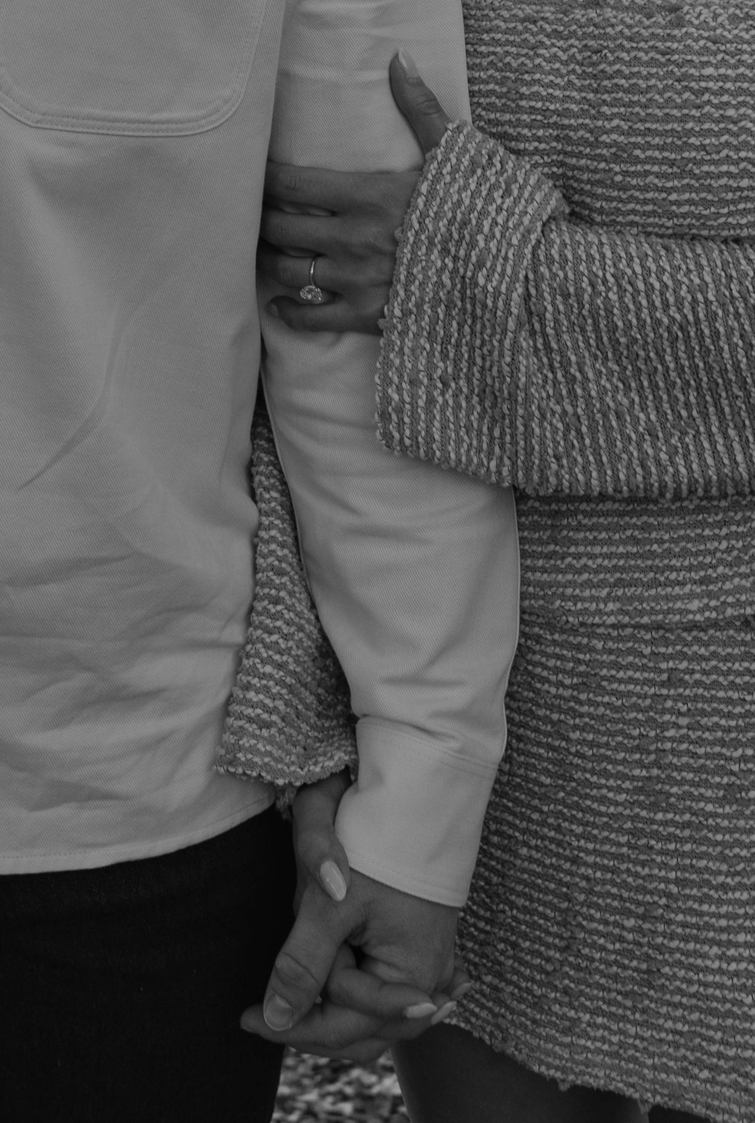 Birmingham Alabama Photographer capturing an engagement session of a couple holding hands in a park in Nashville Tennessee