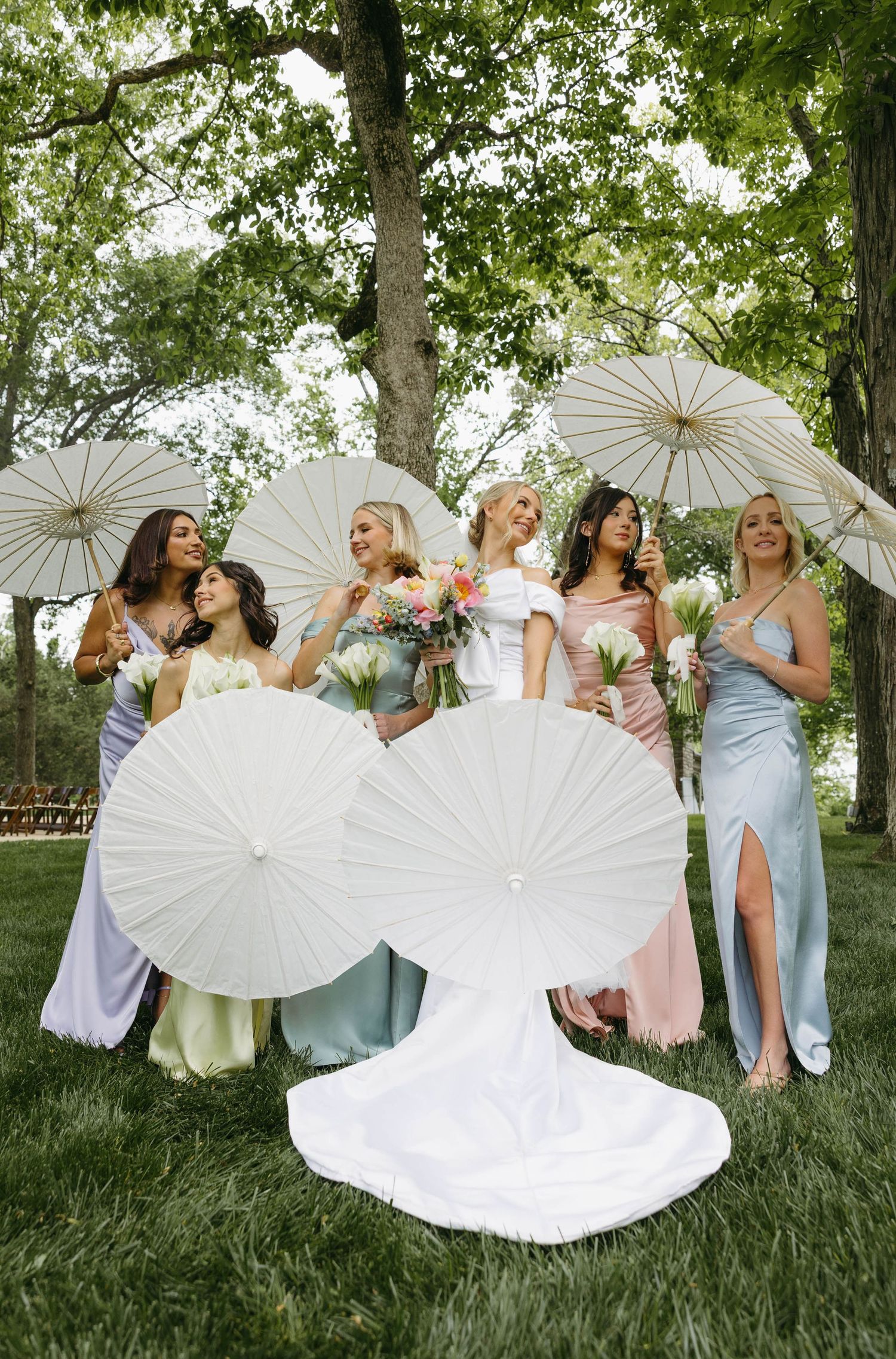 bride with her bridesmaids and their parasols