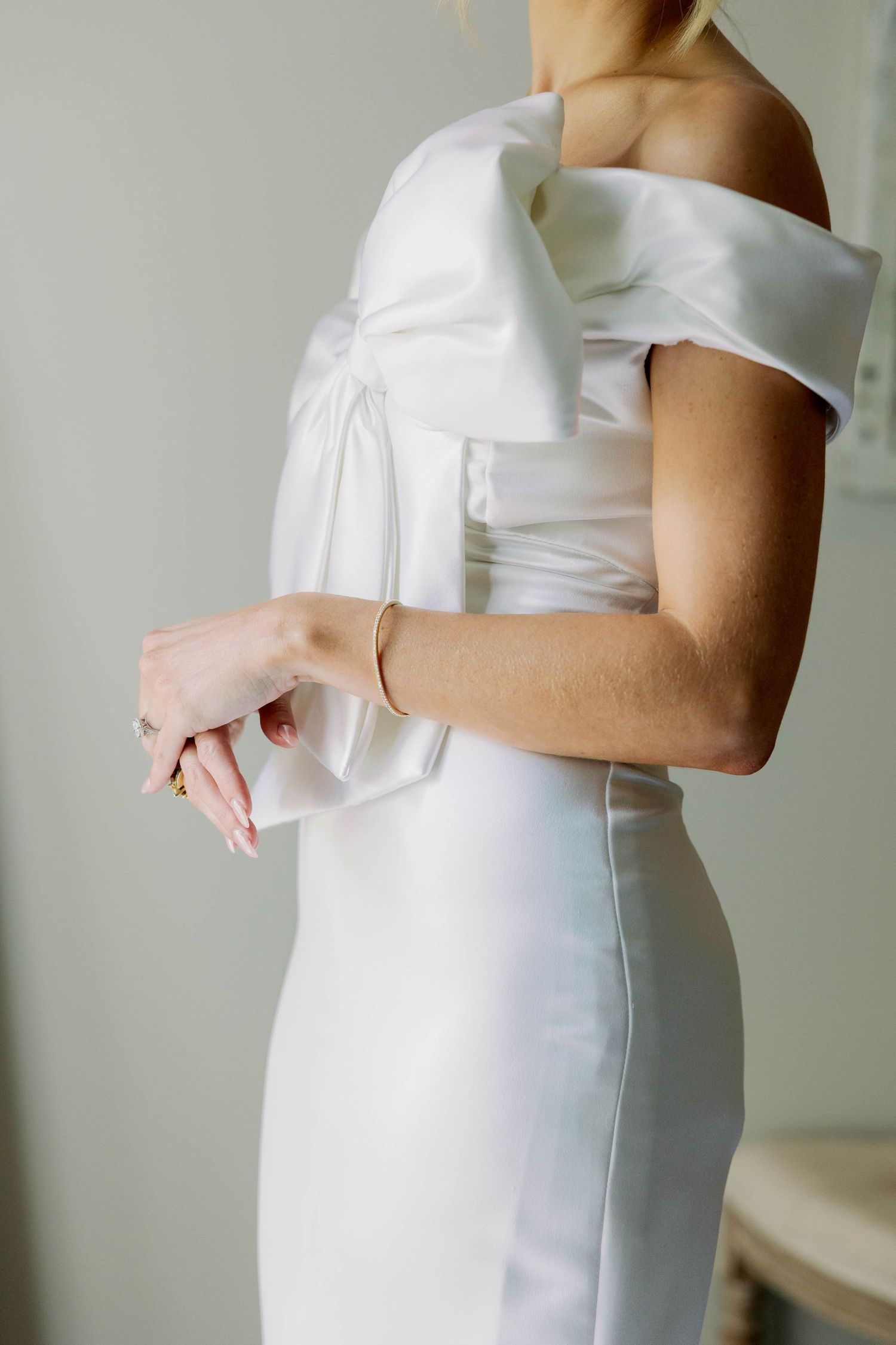 detail of brides bow on dress