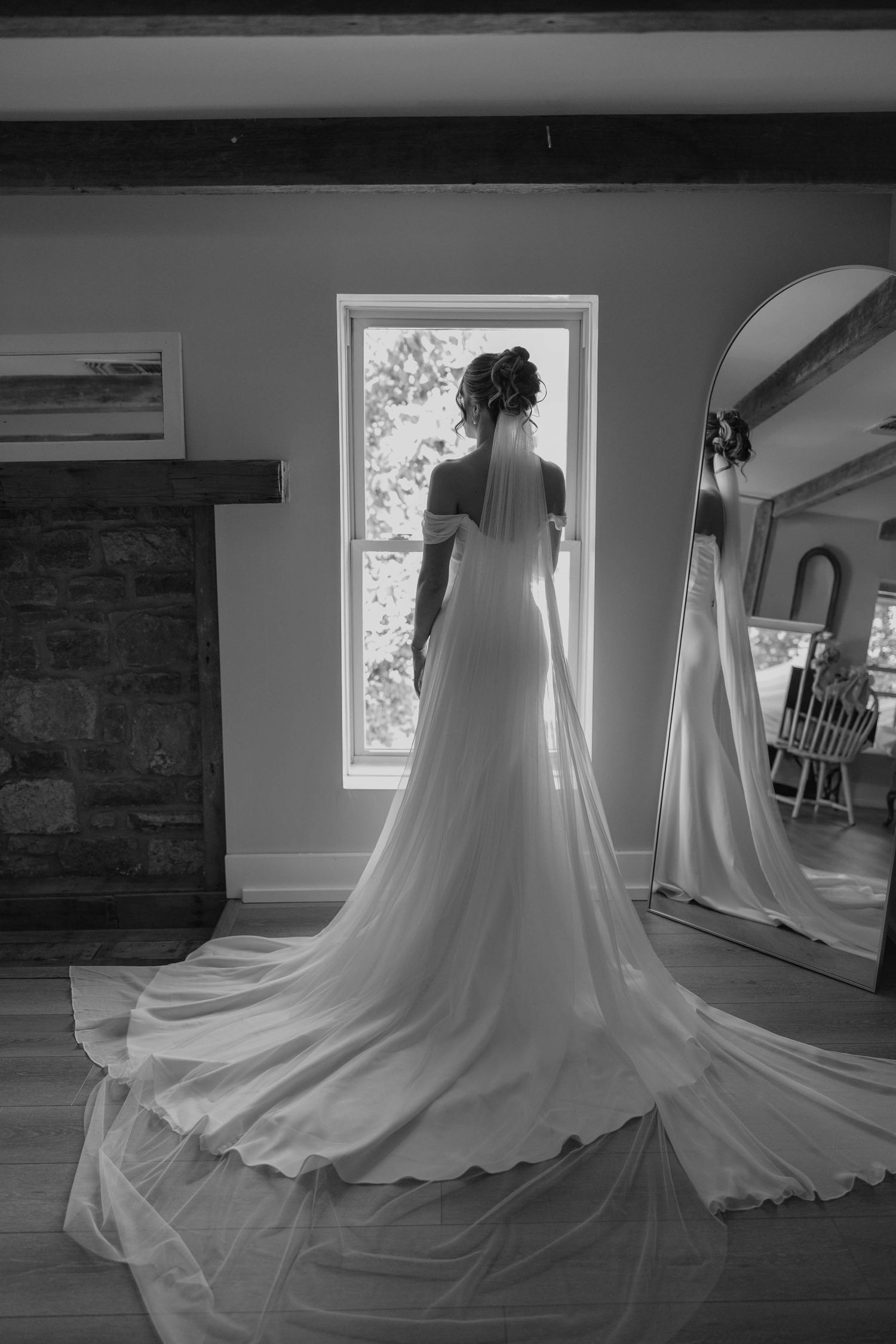 Birmingham Alabama Photographer capturing bride posing with her wedding dress, at Iris Woods Venue in Nashville, Tennessee