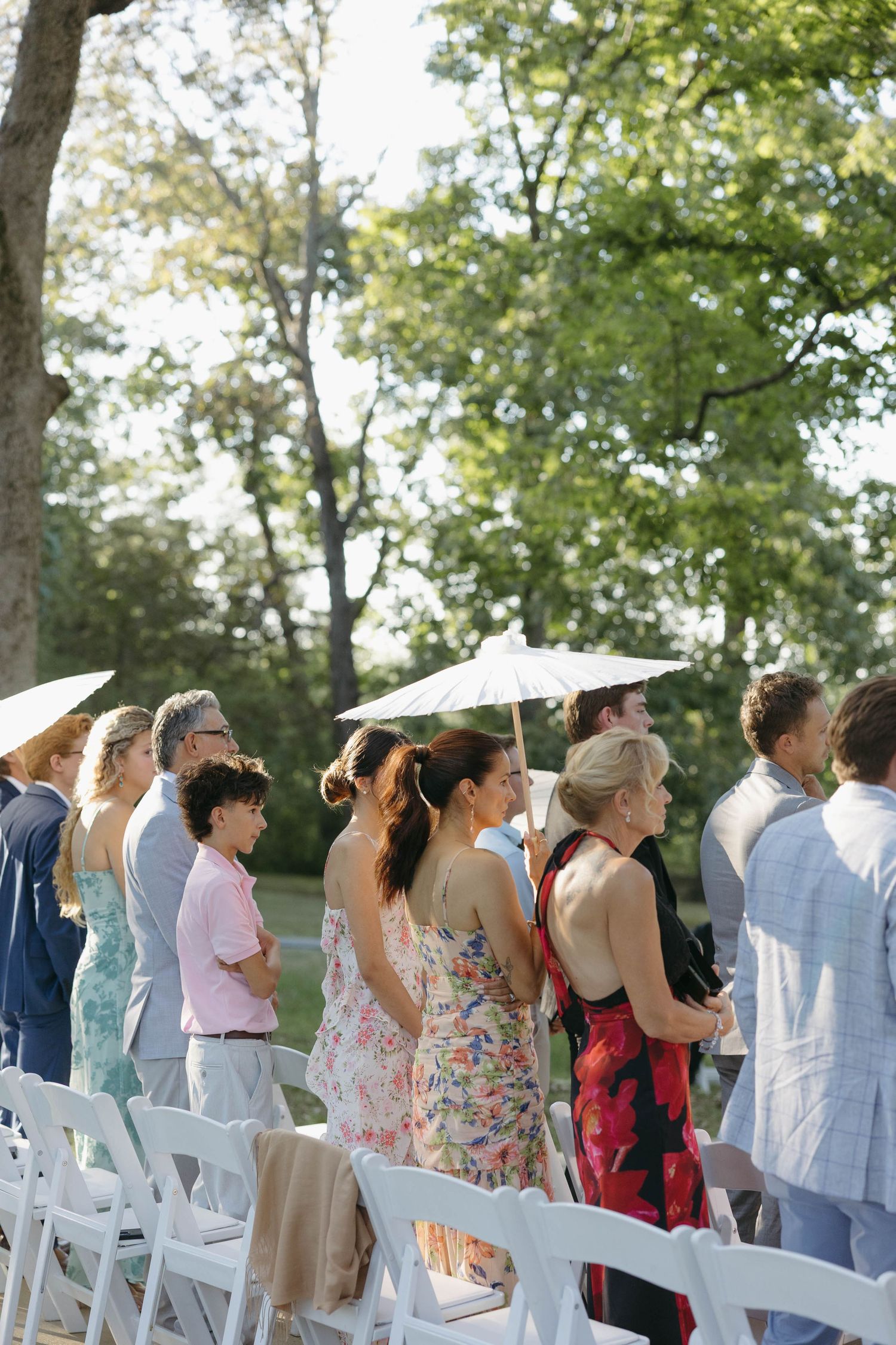 Birmingham Alabama Photographer capturing guests during the wedding at the ceremony space, at Iris Woods Venue in Nashville, Tennessee