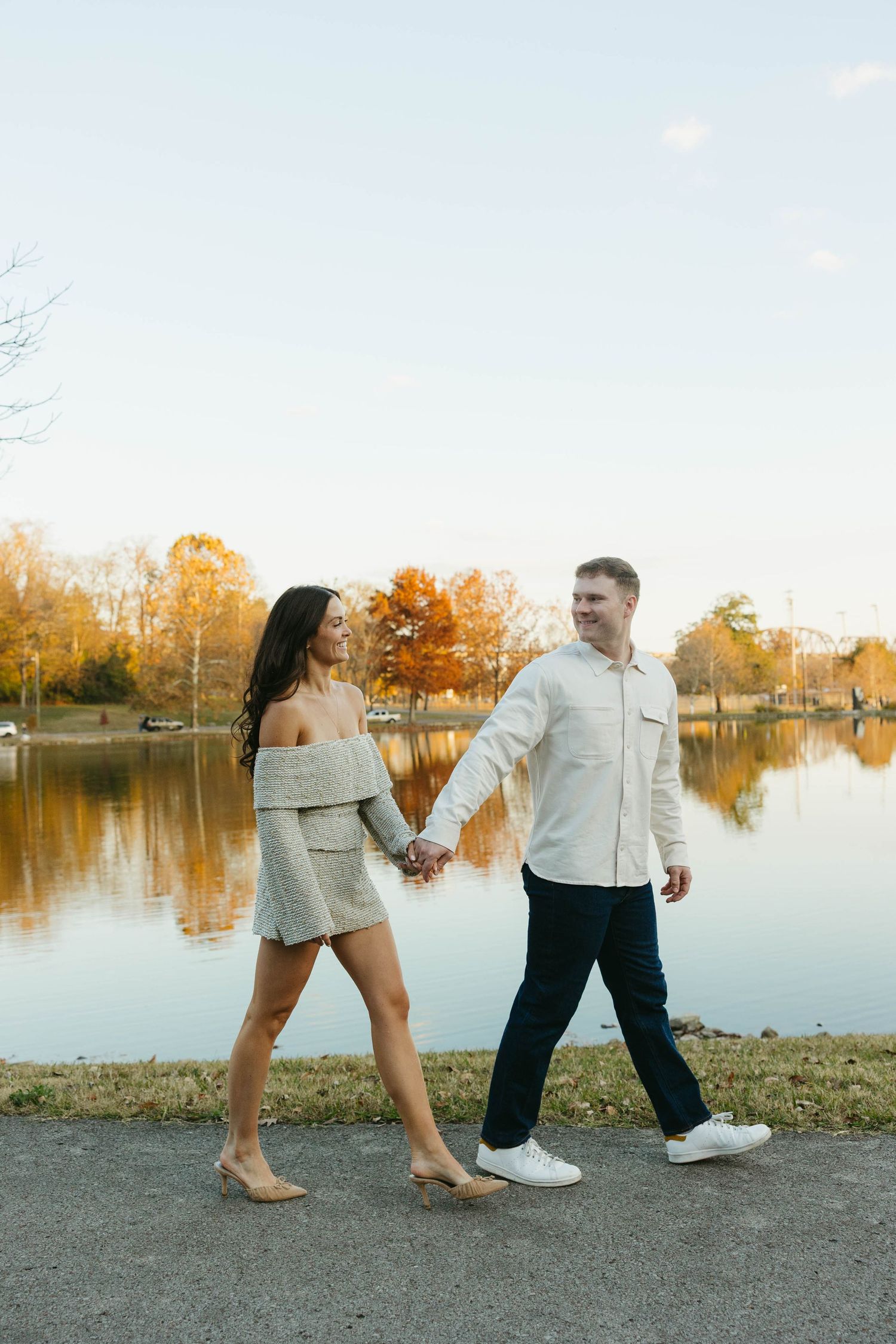 Birmingham Alabama Photographer capturing an engagement session of a couple walking in a park in Nashville Tennessee