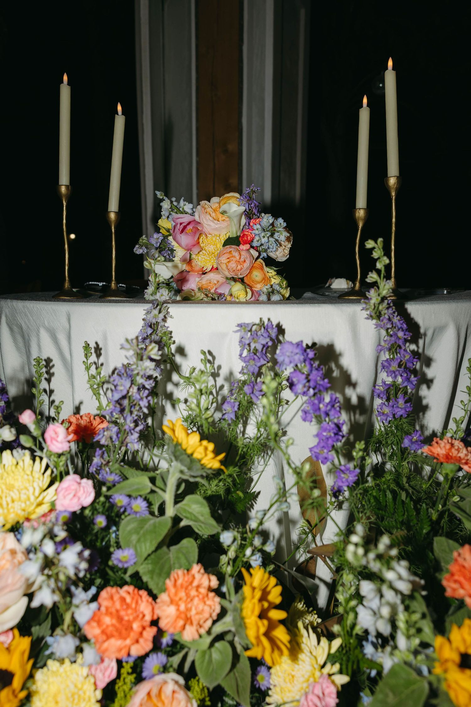 Birmingham Alabama Photographer capturing sweetheart table at reception, at iris woods wedding venue in Nashville Tennessee