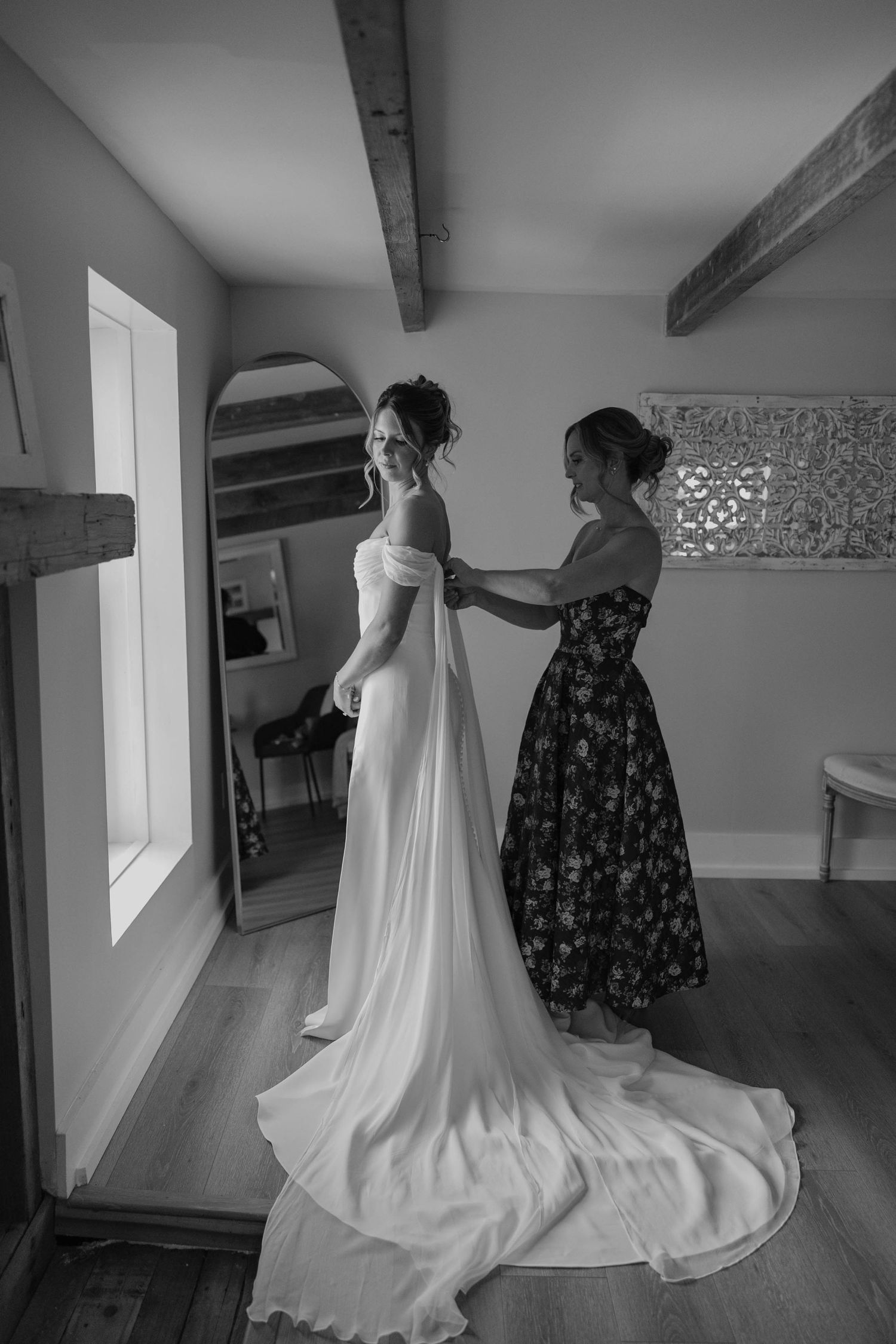 Birmingham Alabama Photographer capturing mother of bride putting on the bride's dress, at Iris Woods Venue in Nashville, Tennessee