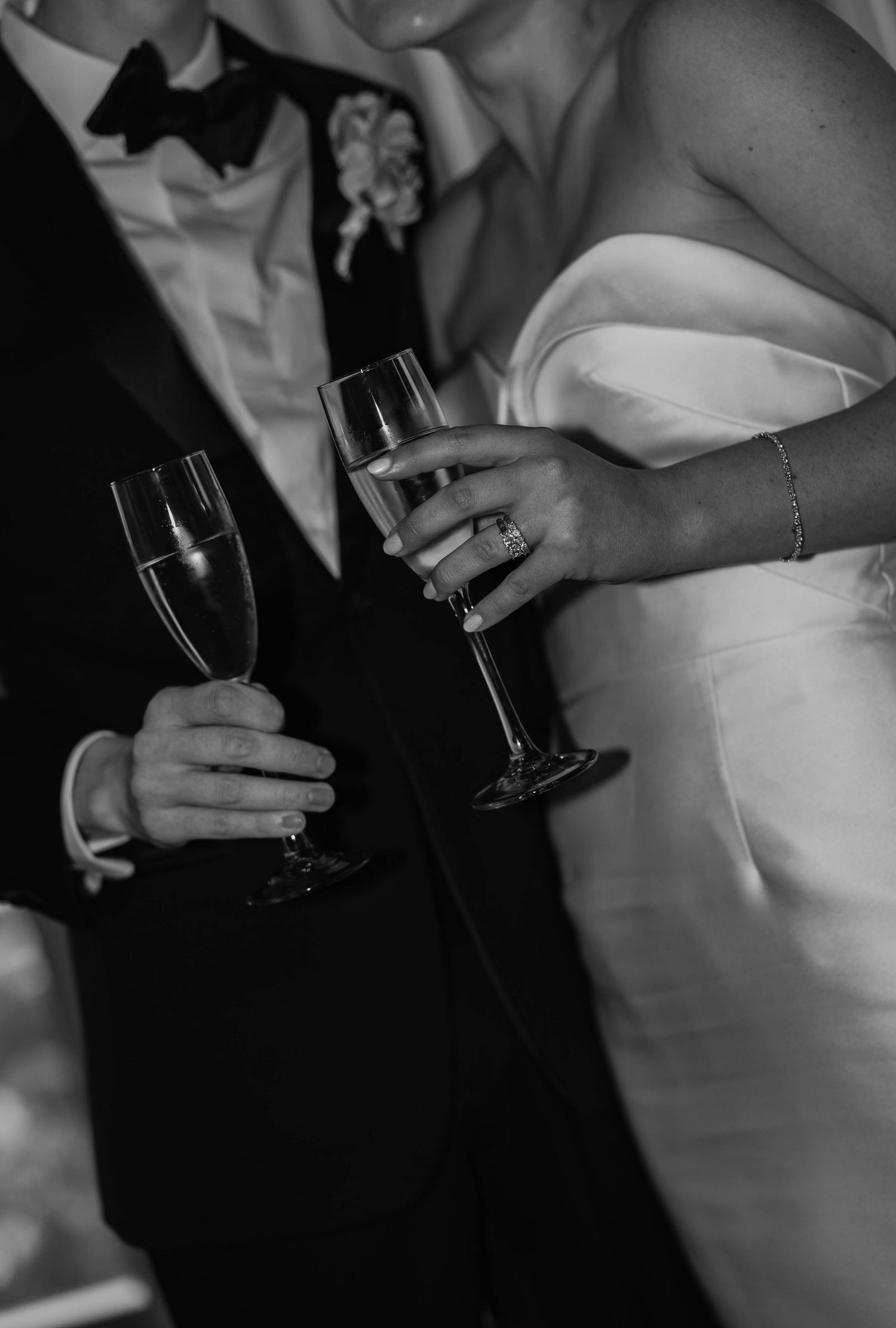 bride and groom holding glasses
