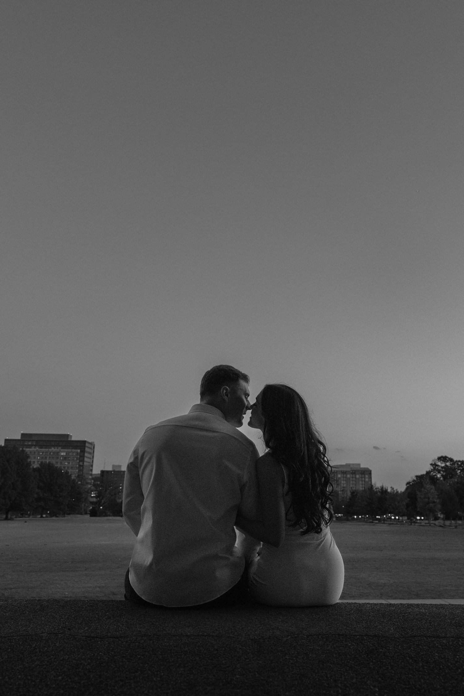 Birmingham Alabama Photographer capturing an engagement session of a couple touching noses  in Nashville Tennessee at the Parthenon