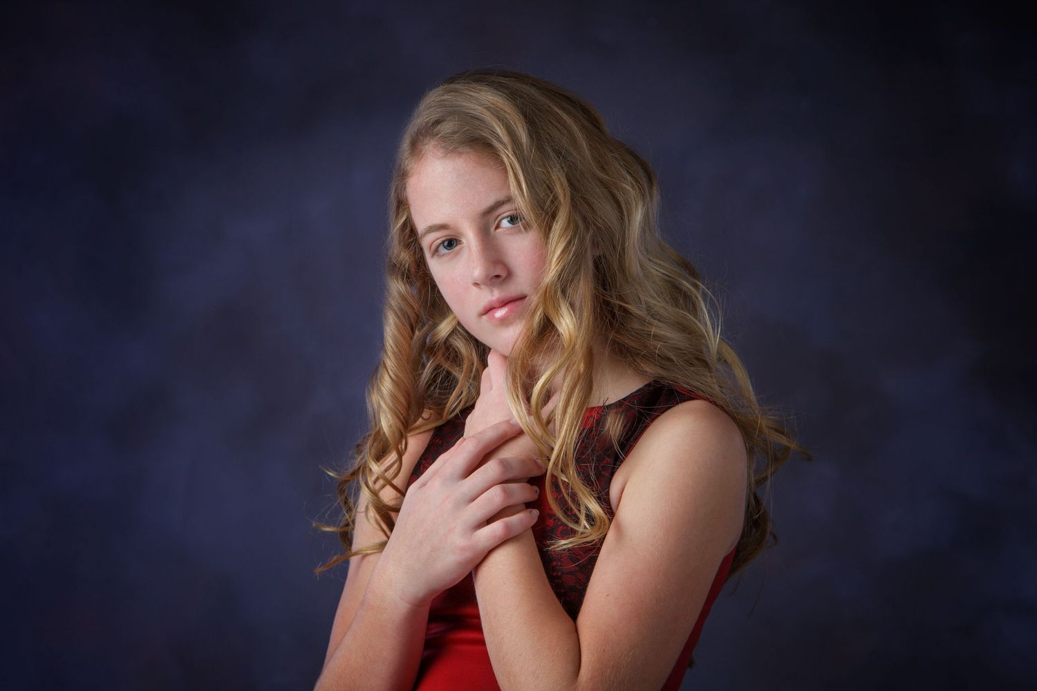 Milestone girls portrait session in Rochester, MI by Jocelyn M. Photography—young blonde woman in a vibrant red dress.