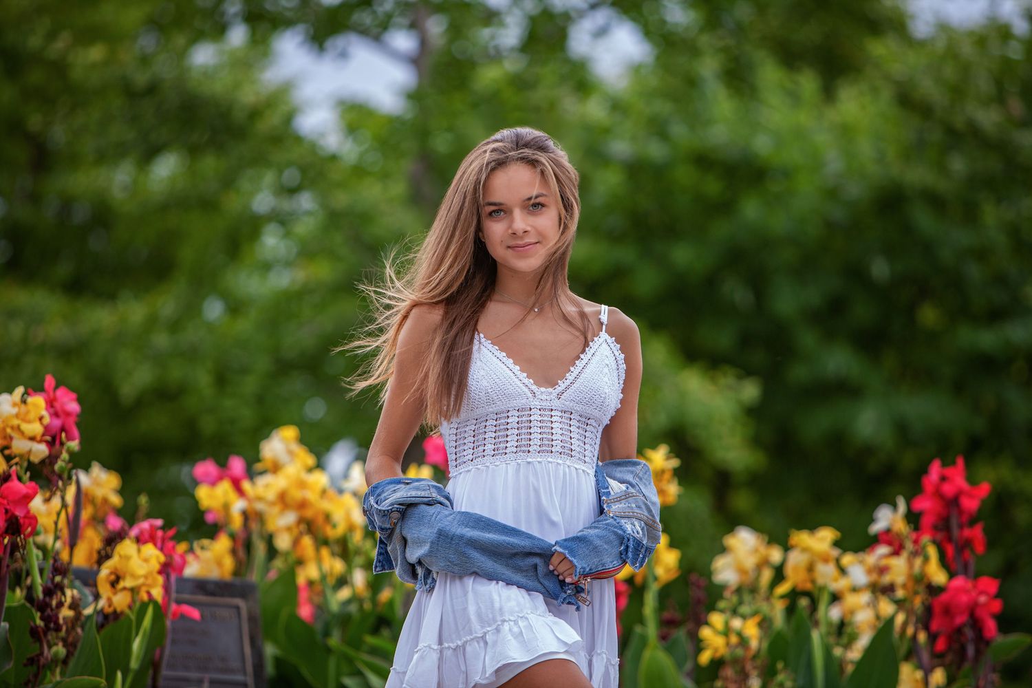 Sweet 16 milestone session in Rochester, MI by Jocelyn M. Photography—young woman in a white dress among garden flowers.