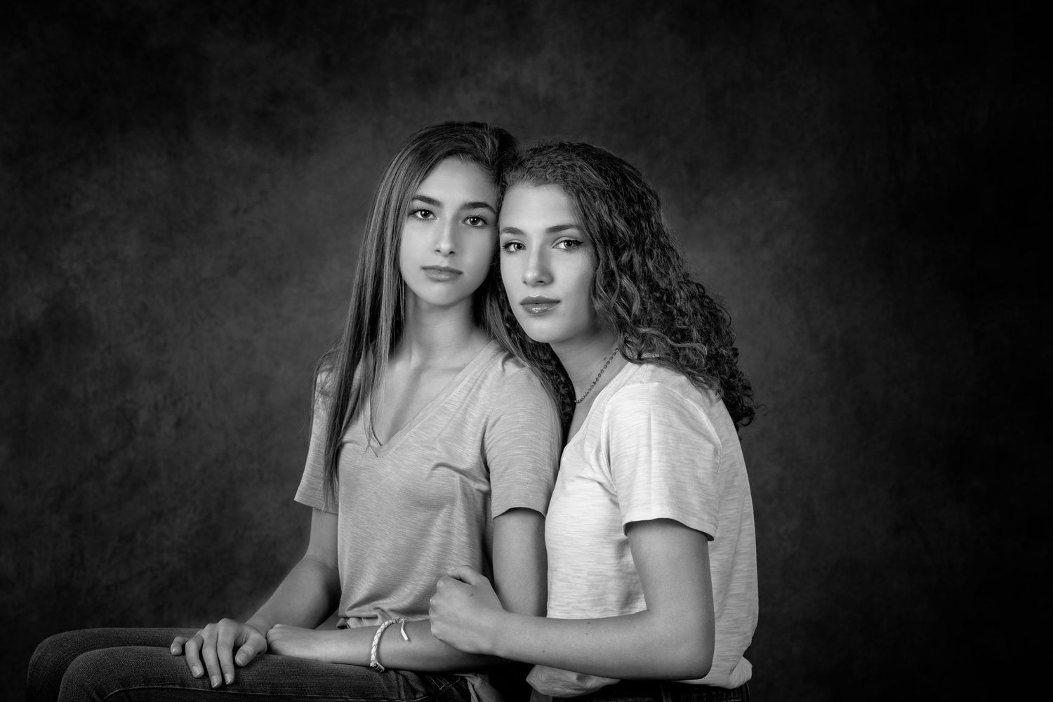 Fine art portrait session in Rochester, MI by Jocelyn M. Photography—black and white studio image of two young sisters.