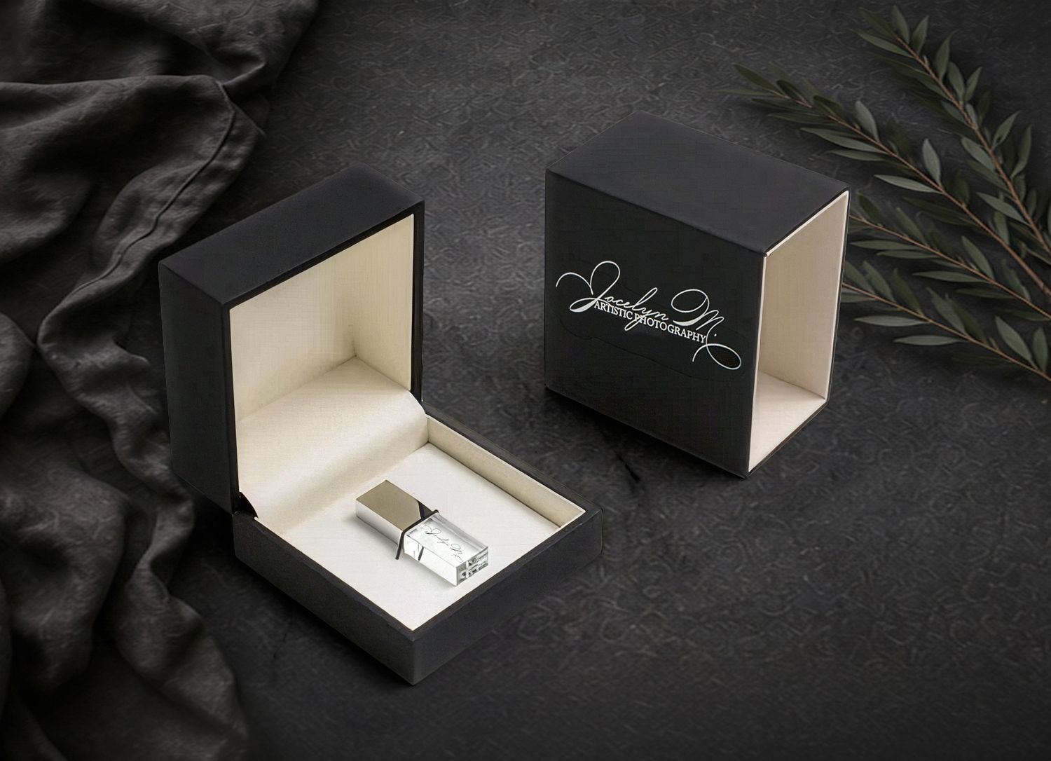 Luxury portrait product packaging by Jocelyn M. Photography—elegant black USB gift box with cursive studio logo.
