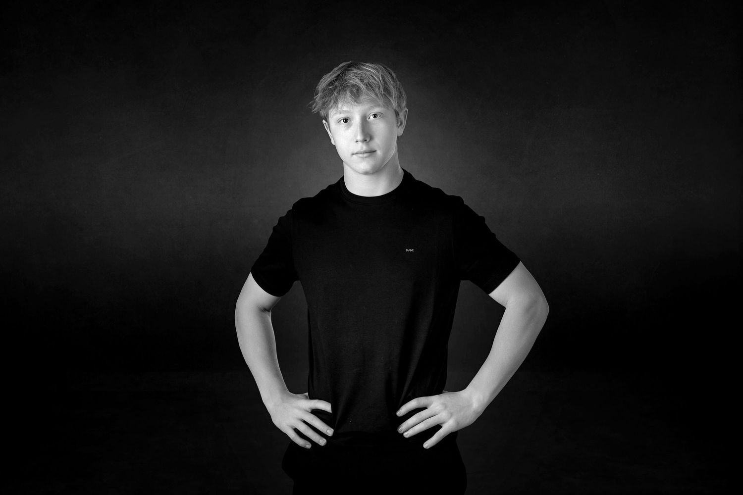 Milestone 16 year portrait for guys in Rochester, MI by Jocelyn M. Photography—black and white studio photo of a young man.