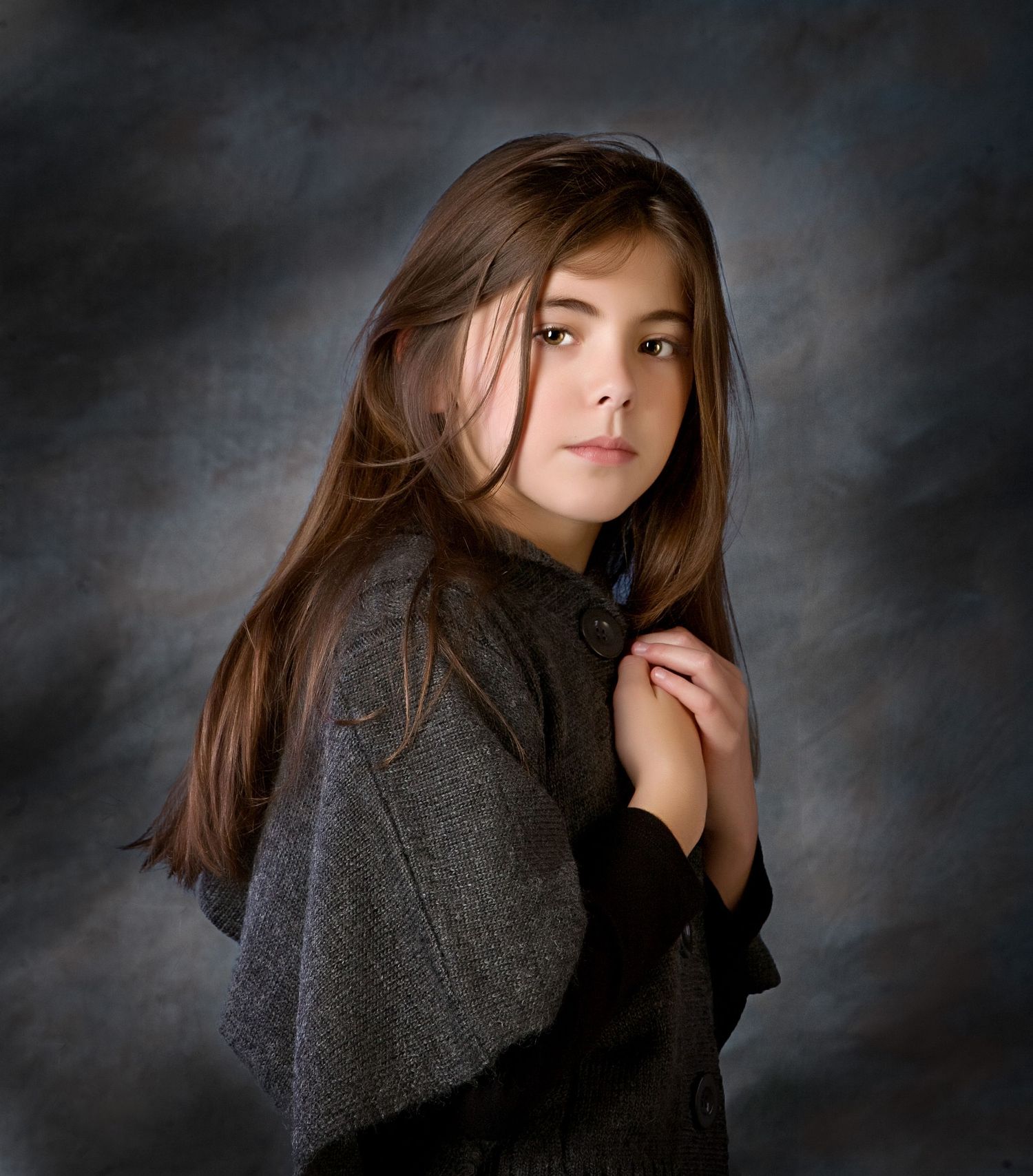Fine art portrait by Jocelyn M. Photography—young girl with long brown hair wearing a gray cape shawl.