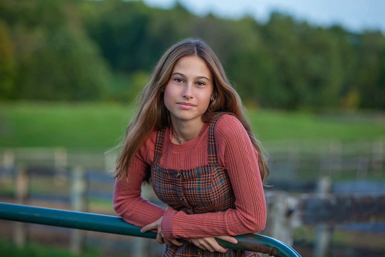 12-year-old child milestone session in Rochester, MI by Jocelyn M. Photography—young girl leaning on outdoor railing.