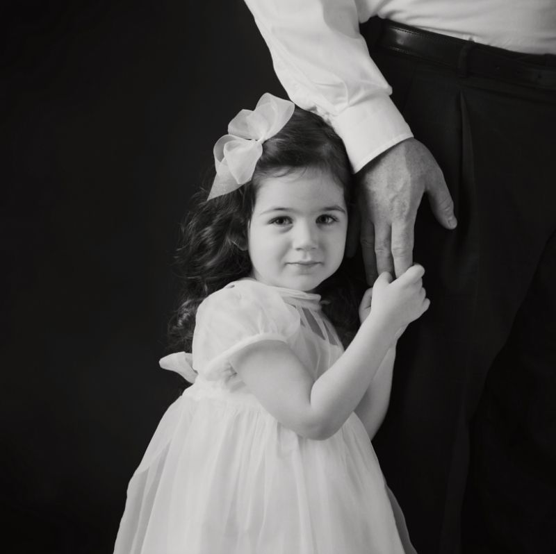Children's studio portrait in Rochester, MI by Jocelyn M. Photography—black and white photo of a girl in a dress.