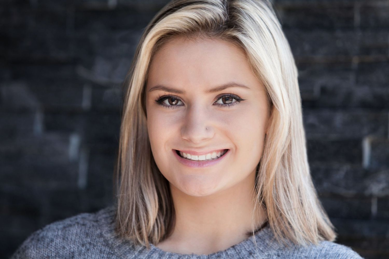 Senior girl portrait with shoulder-length hair wearing a gray sweater, by Jocelyn M. Photography in Rochester, MI