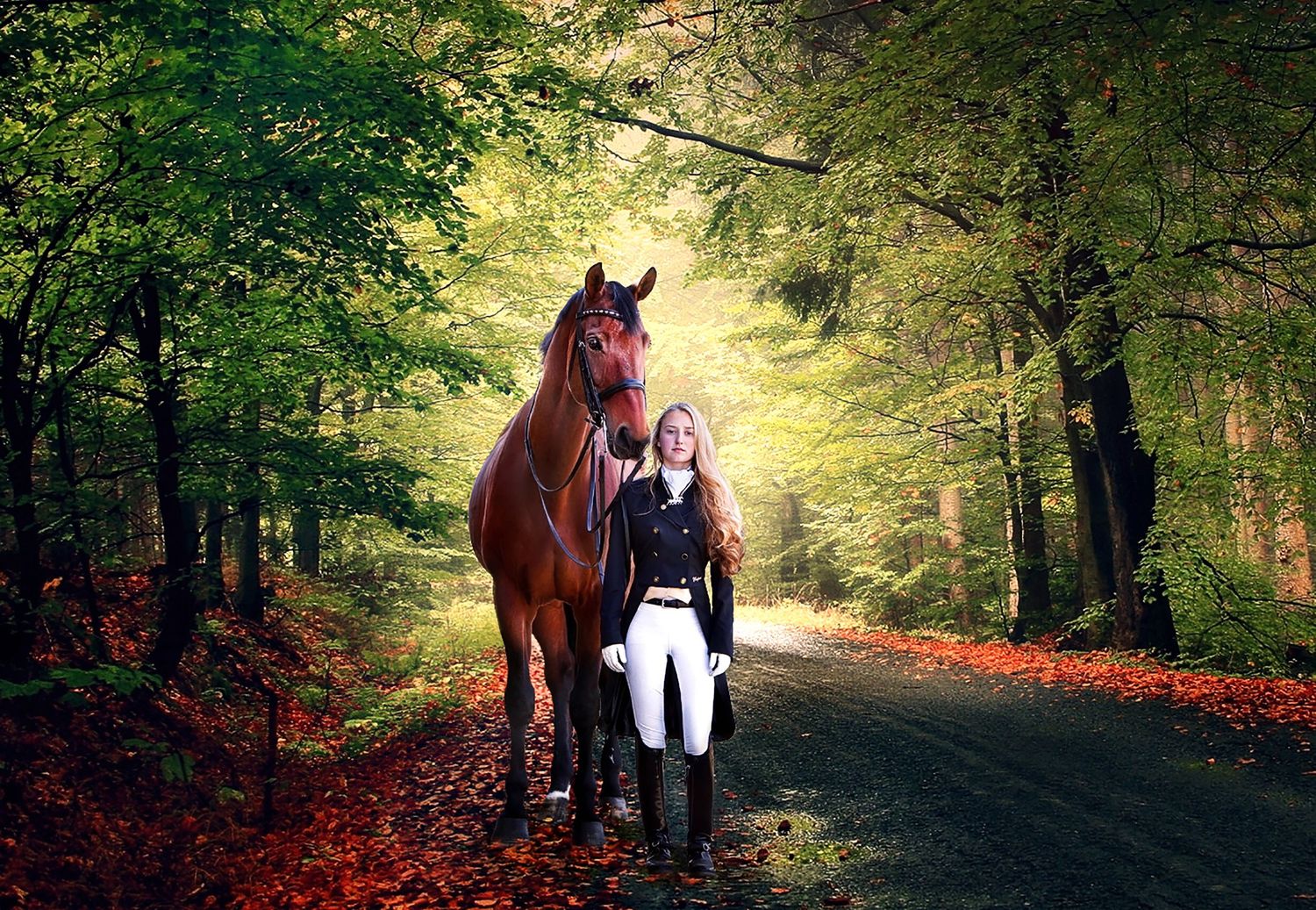A young blonde woman in equestrian attire walks beside a chestnut horse on a scenic forest path lined with colorful autumn leaves.