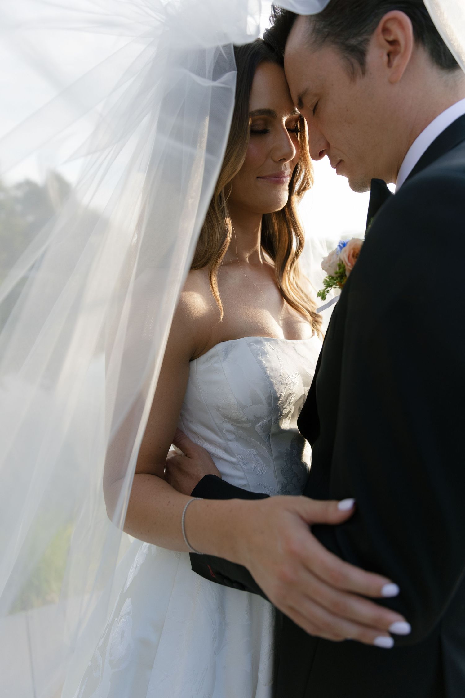 Romantic wedding photos captured in soft lighting showing intimate moments between newlyweds.