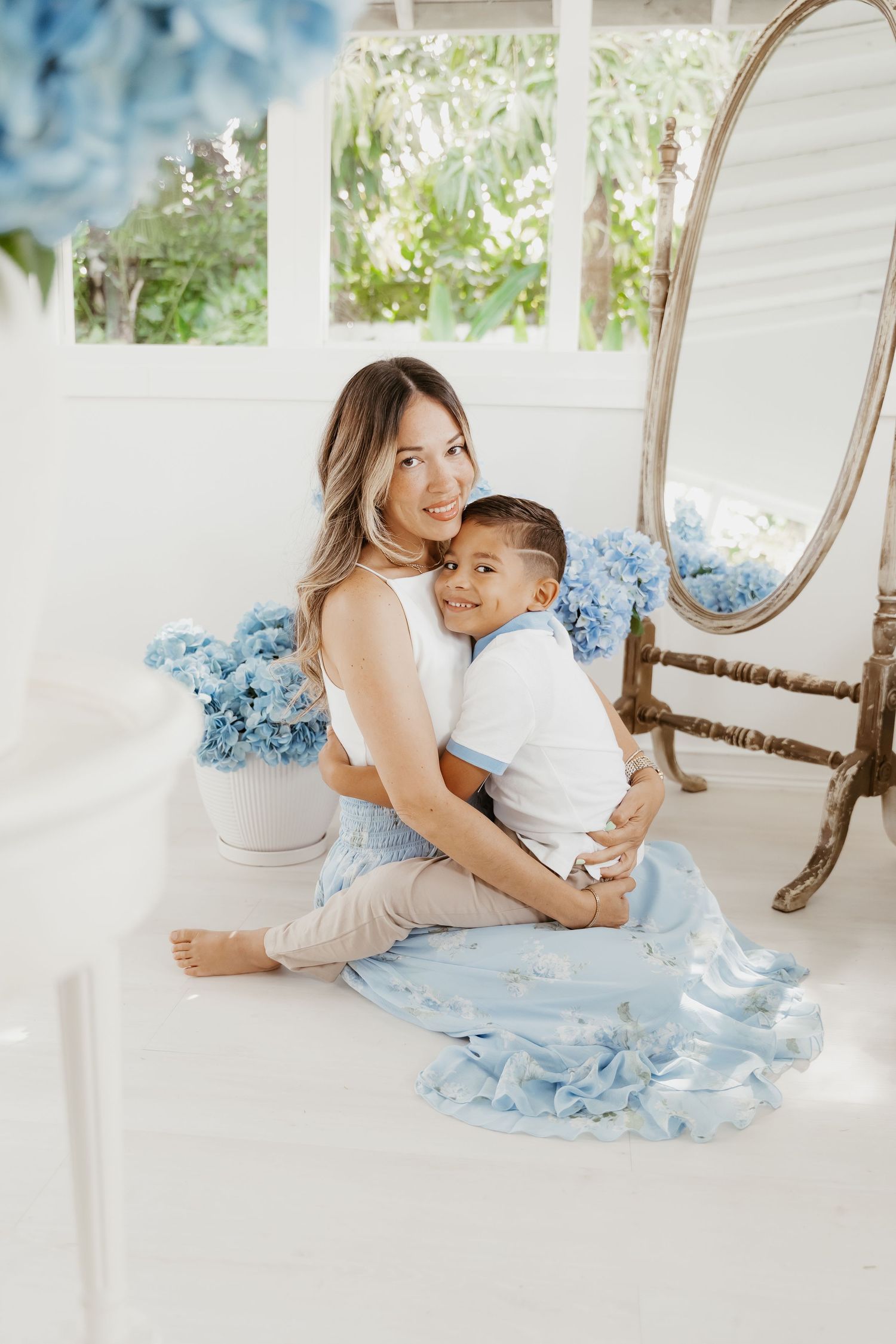 Editorial-style portrait of family in neutral tones during coastal shoot