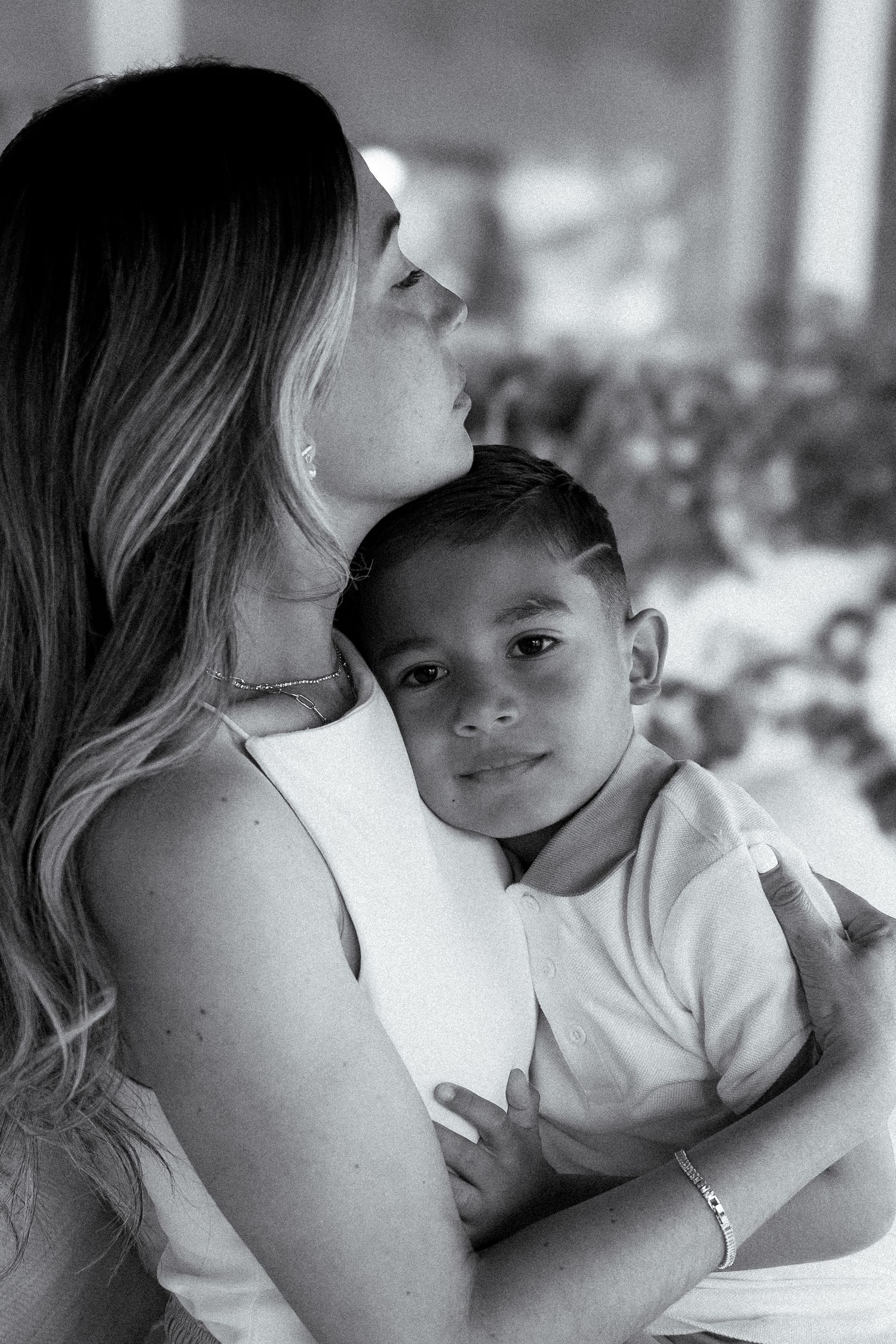 Black and white style portrait of mom and son in during at home shoot