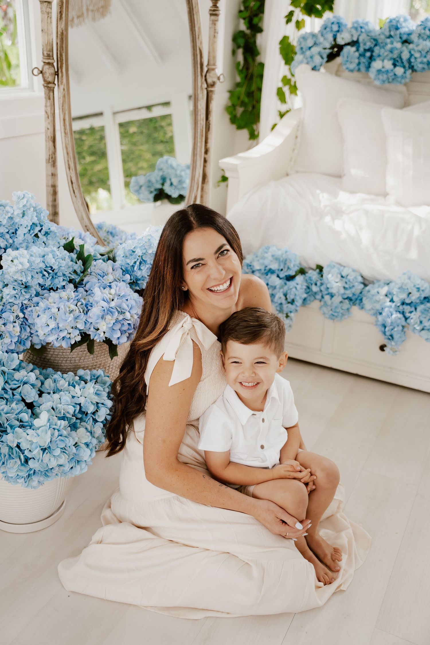 Mother holding child close during in-home lifestyle family session in Coral Gables