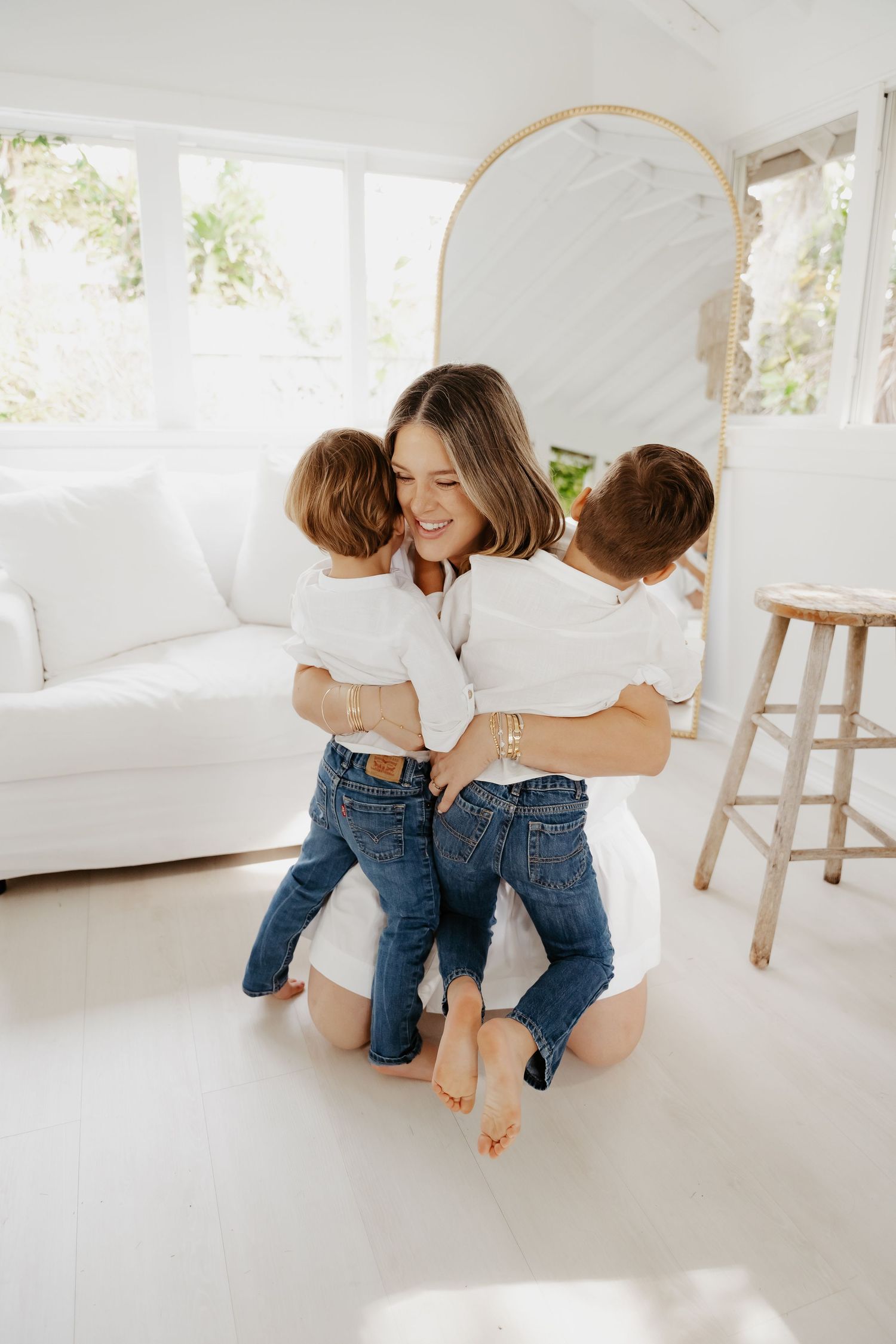 Mom playing with son during playful family candid session