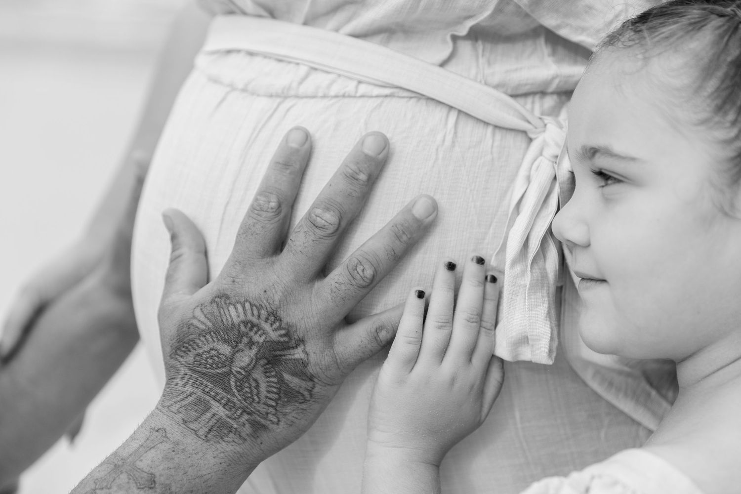 Series of close-up black and white shots showing hands and expressions.