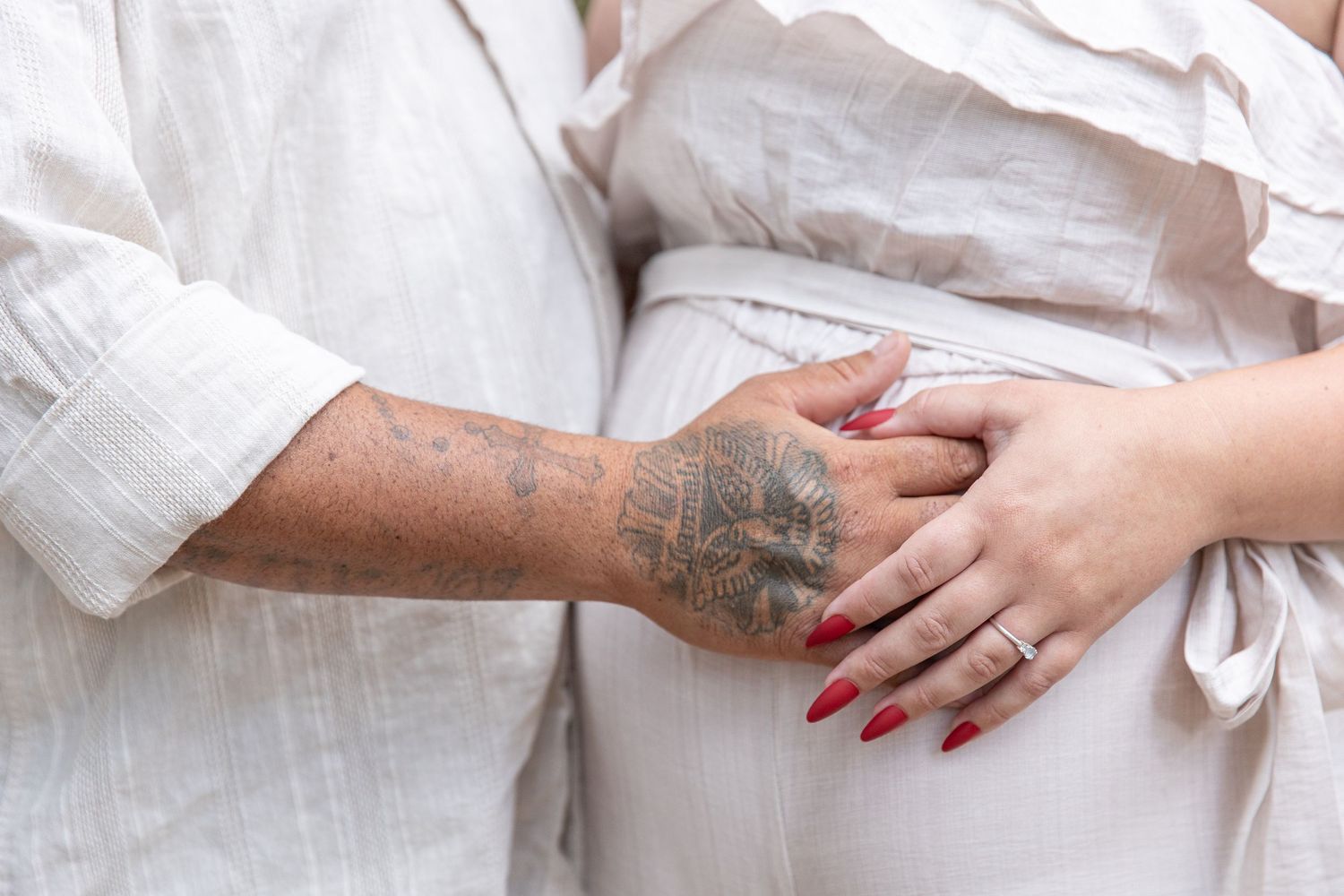 Close-up images of hands and wedding rings against white fabric backgrounds.