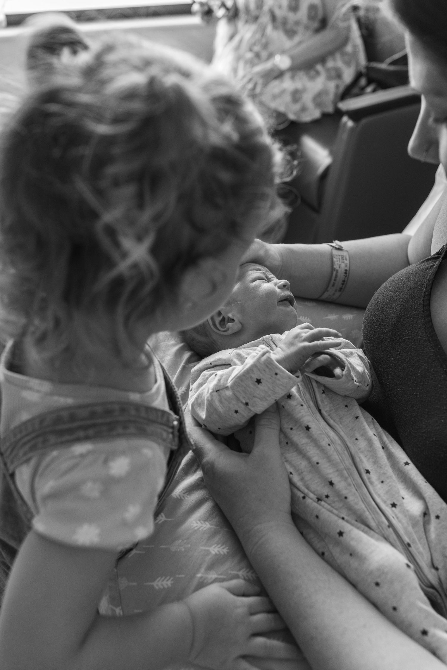 Emotional first family moments captured in a Fresh 48 session.