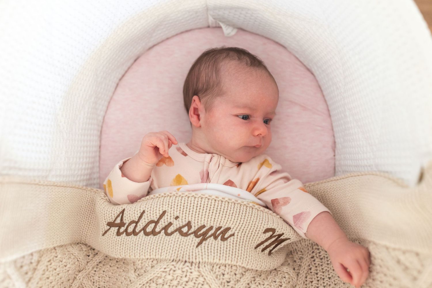 Natural, unposed newborn moments in a cosy home setting.