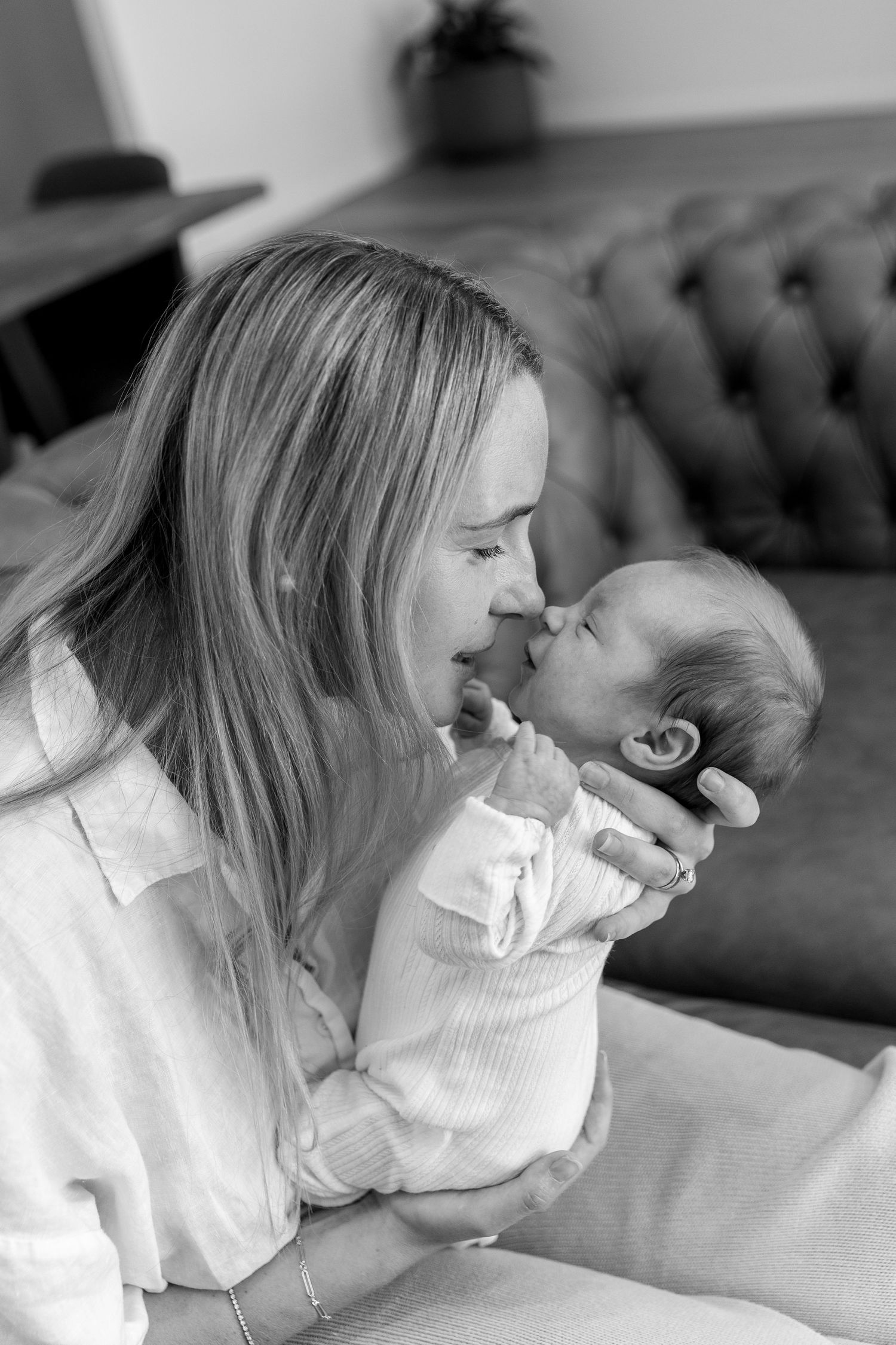 Black and white series of intimate family moments with newborn baby.