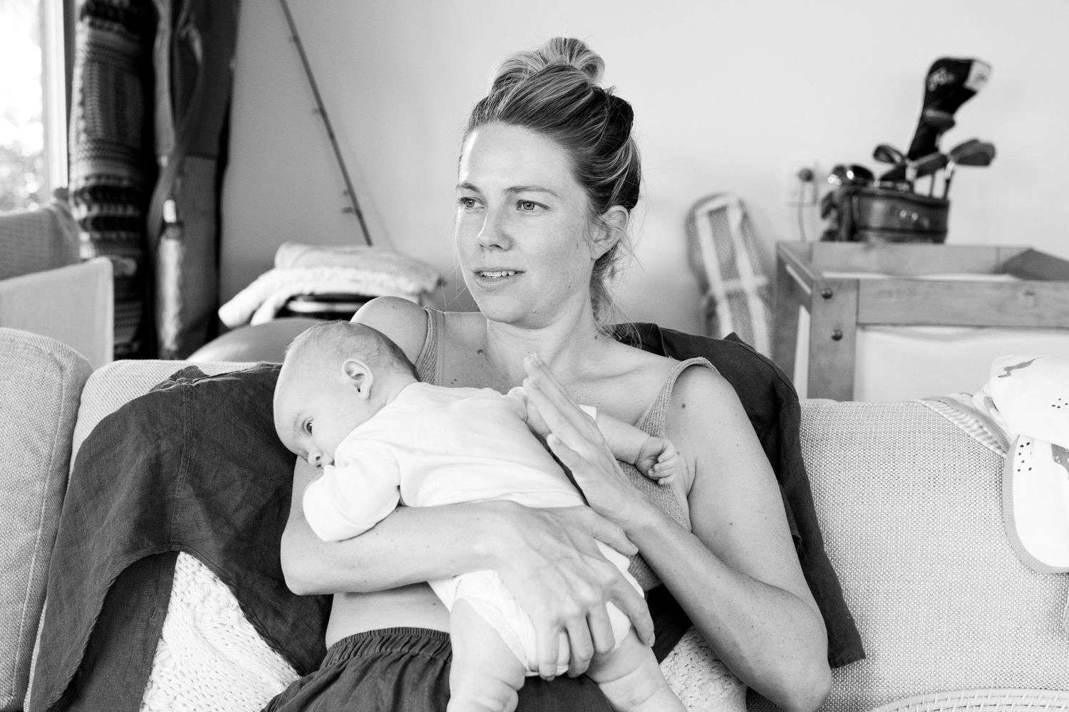 Candid photo of mum holding baby during a relaxed lifestyle session.