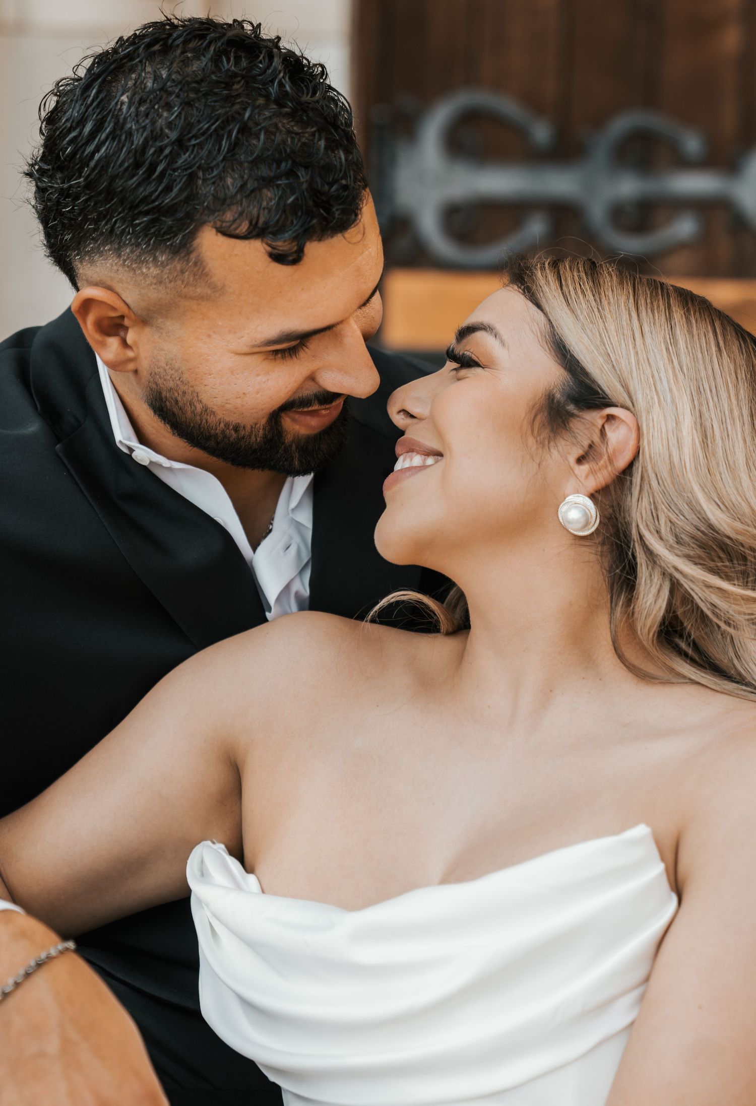 A romantic wedding couple sharing an intimate moment in a series of close-up shots showing affection and love.