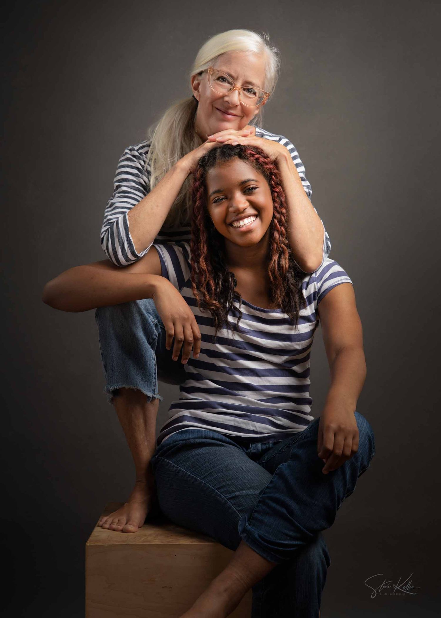 A heartwarming sequence of candid moments showing a playful interaction between two people on a wooden box.