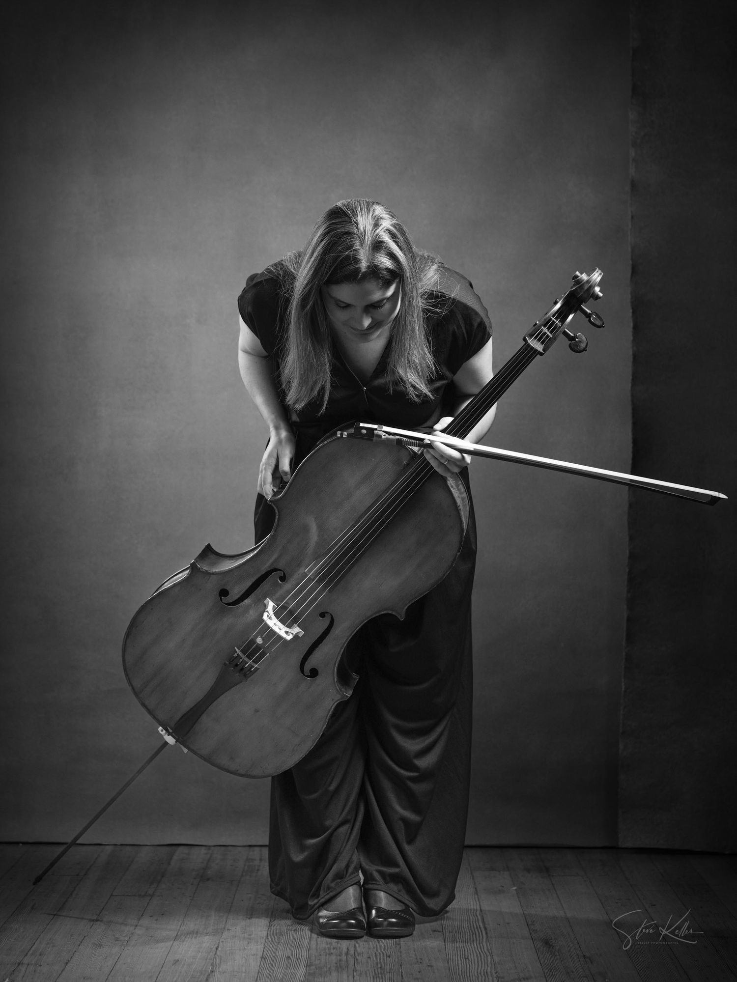 A series of dramatic black and white photographs showing a cellist performing in elegant formal attire against a dark background.