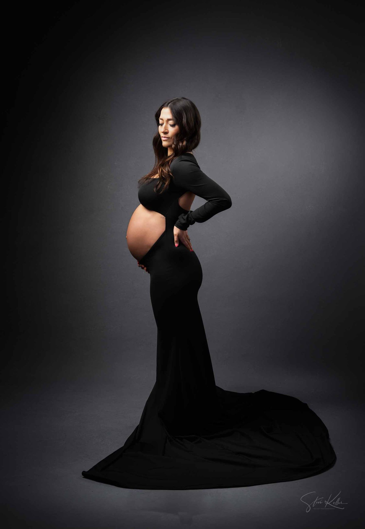 A series of maternity portraits showing a pregnant woman in a flowing black dress against a dark dramatic background.