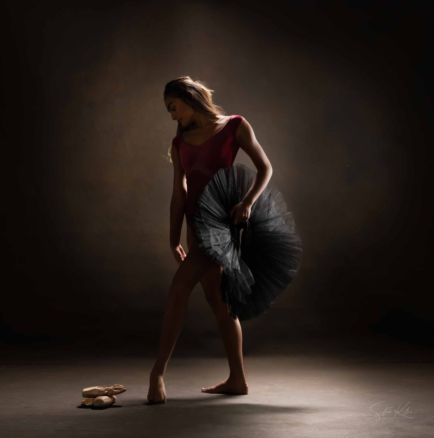 Artistic dance sequence captures flowing movements in grey tulle dress against moody lighting.